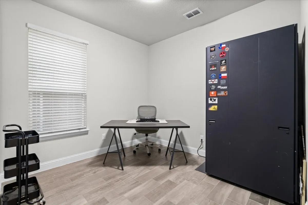 Versatile flex room perfect for a home office, gym, hobby room, or playroom