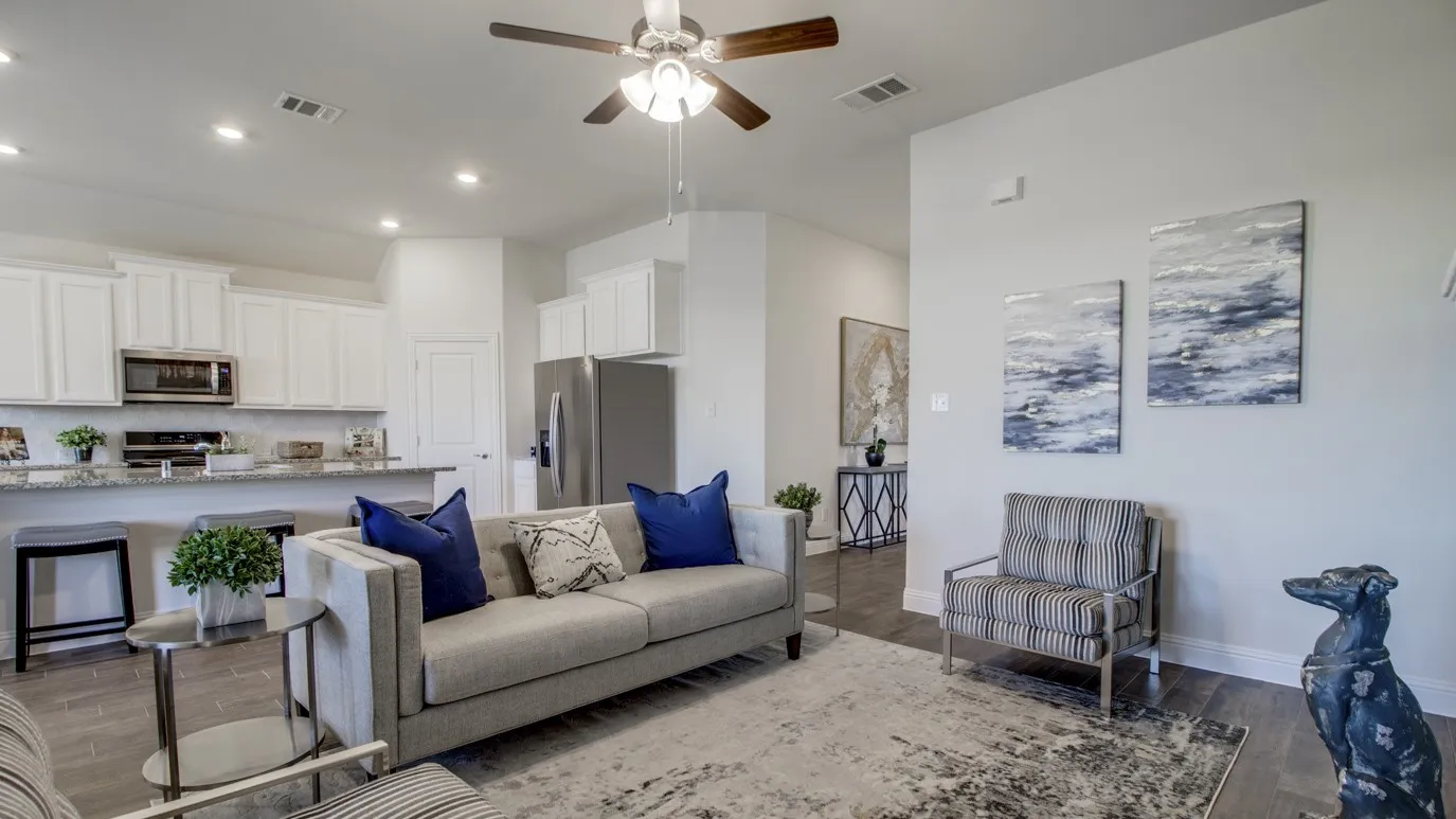 Open-concept living space featuring wood-finish flooring, recessed lighting, and a ceiling fan