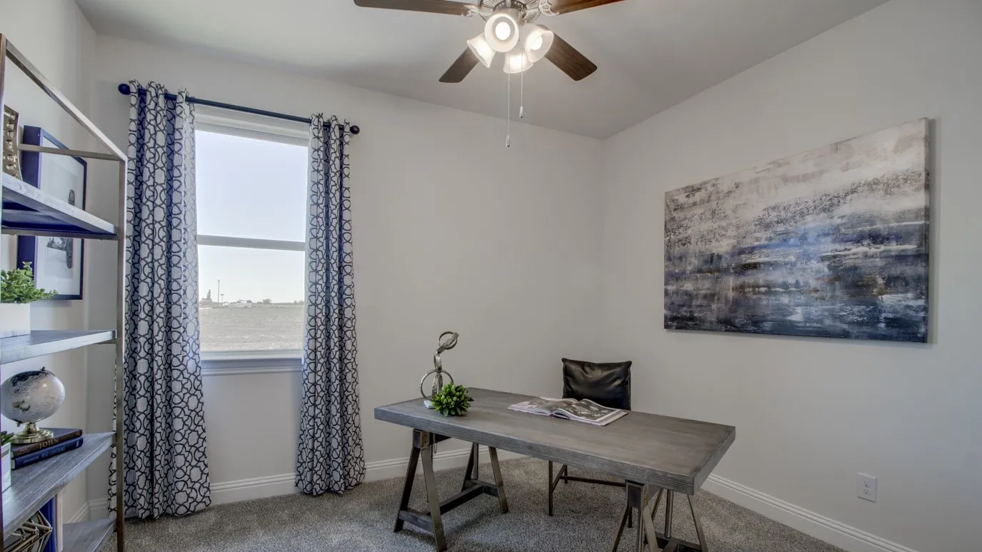 Room featuring neutral wall tones, a ceiling fan with integrated lighting, and carpeted flooring