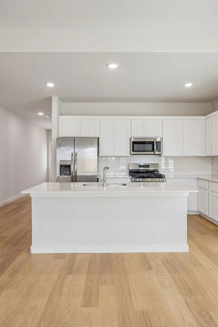 Kitchen in the Stanley II home plan by Trophy Signature Homes – REPRESENTATIVE PHOTO