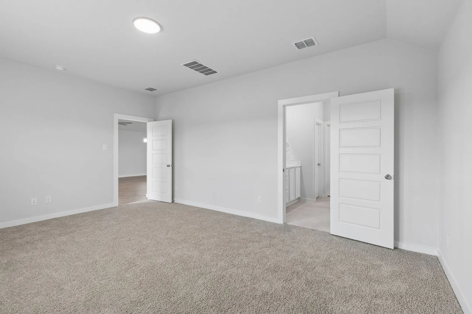 Primary Suite in the Oscar home plan by Trophy Signature Homes – REPRESENTATIVE PHOTO