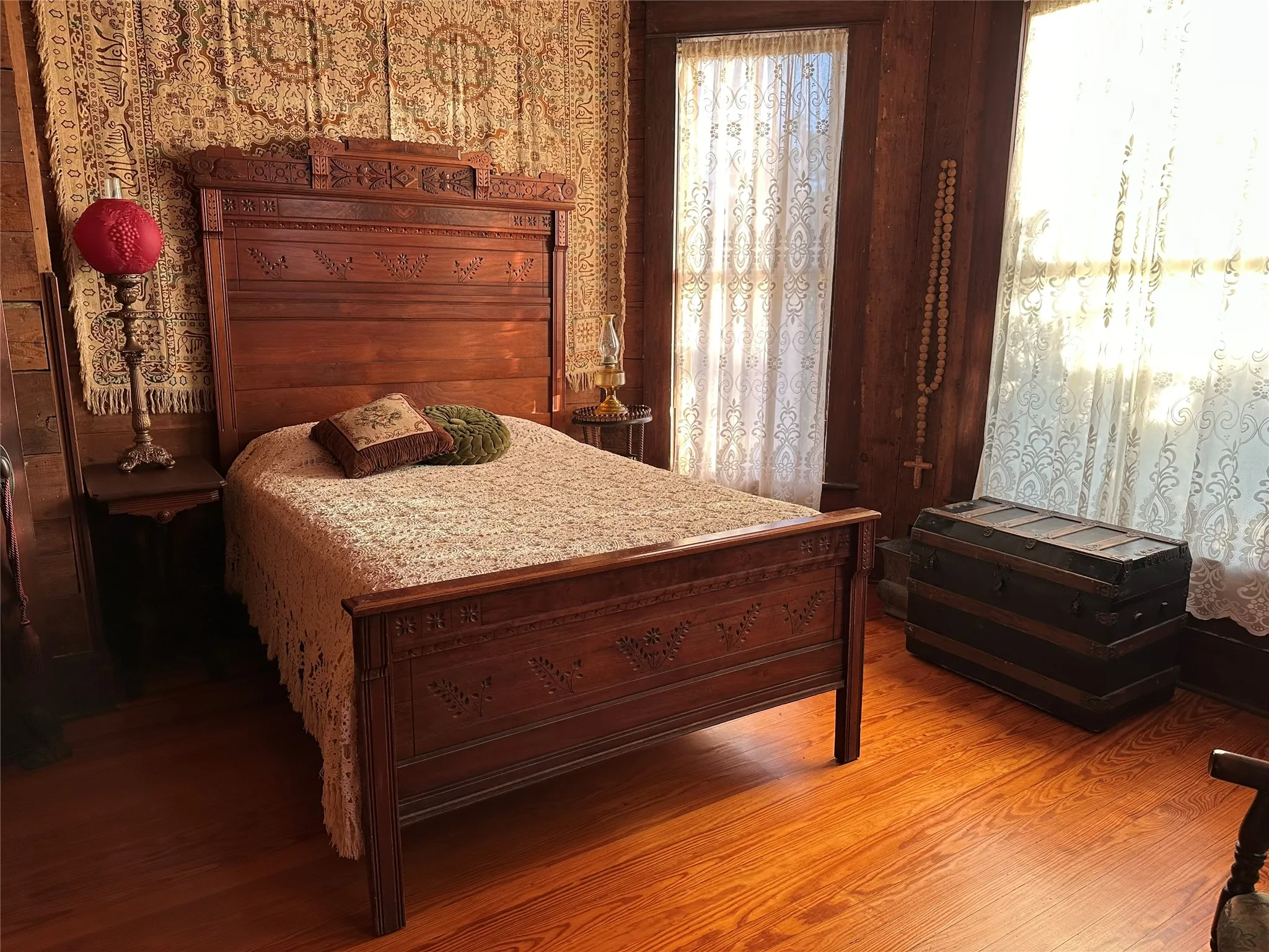 Hardwood flooring complements rich wood paneled walls -