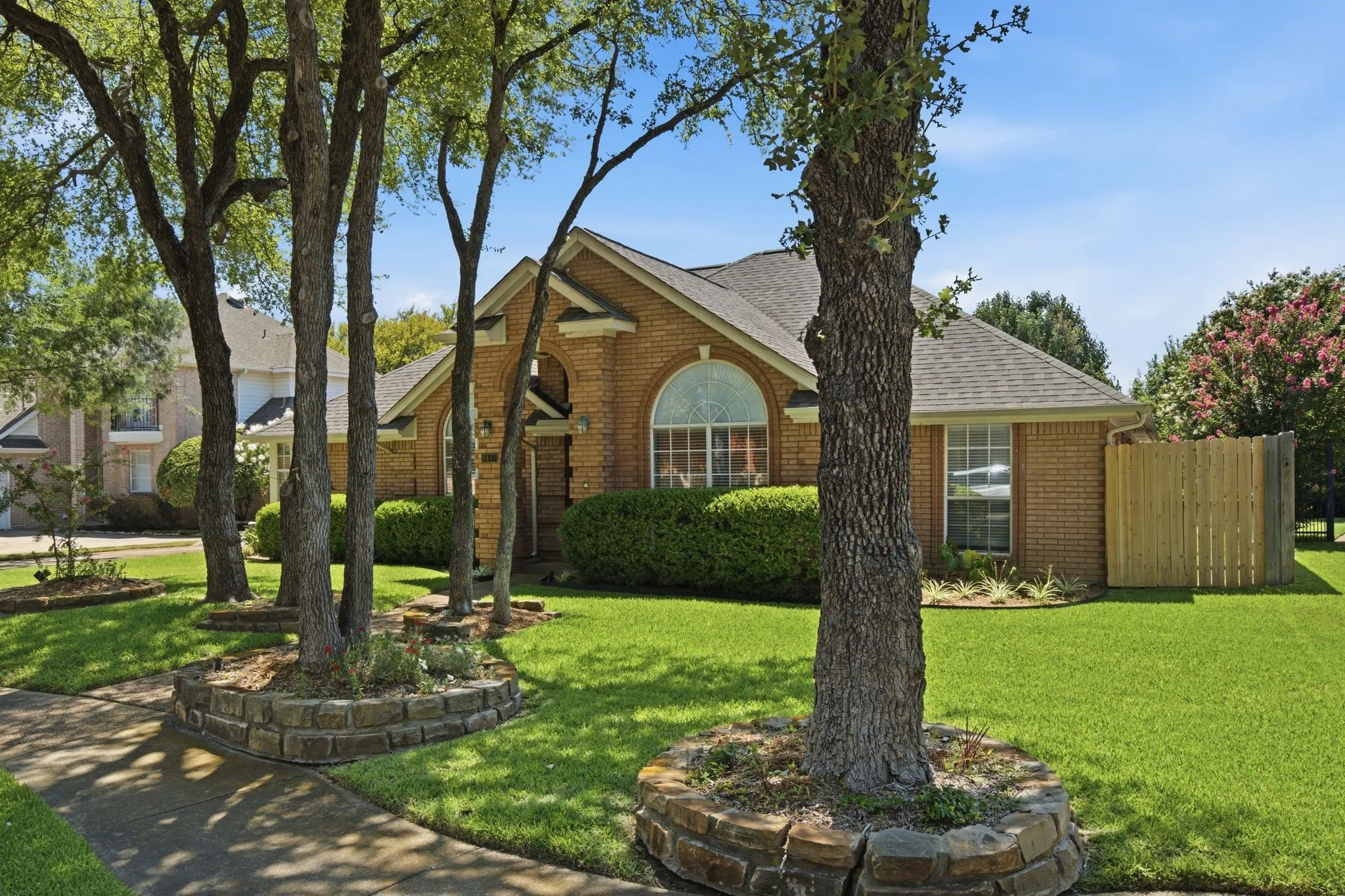 Brick facade residence with a gabled roofline