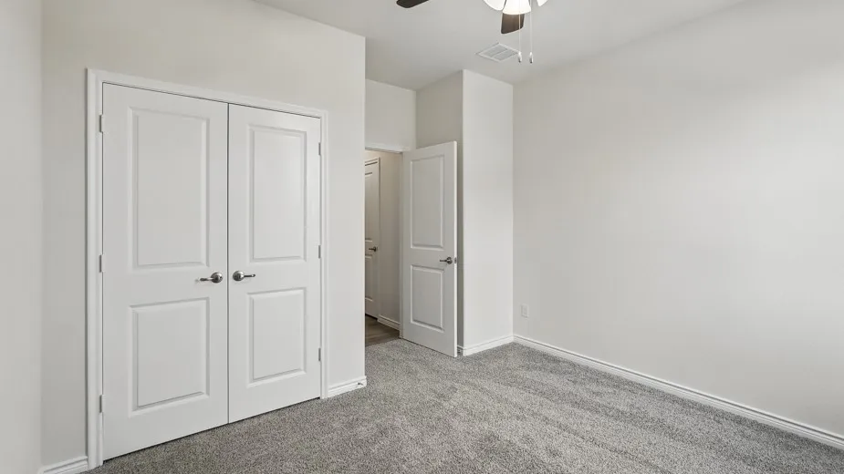 Room featuring neutral wall finishes and grey carpet