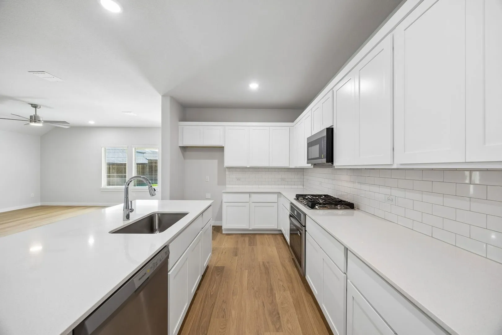 Kitchen in the Oscar home plan by Trophy Signature Homes – REPRESENTATIVE PHOTO