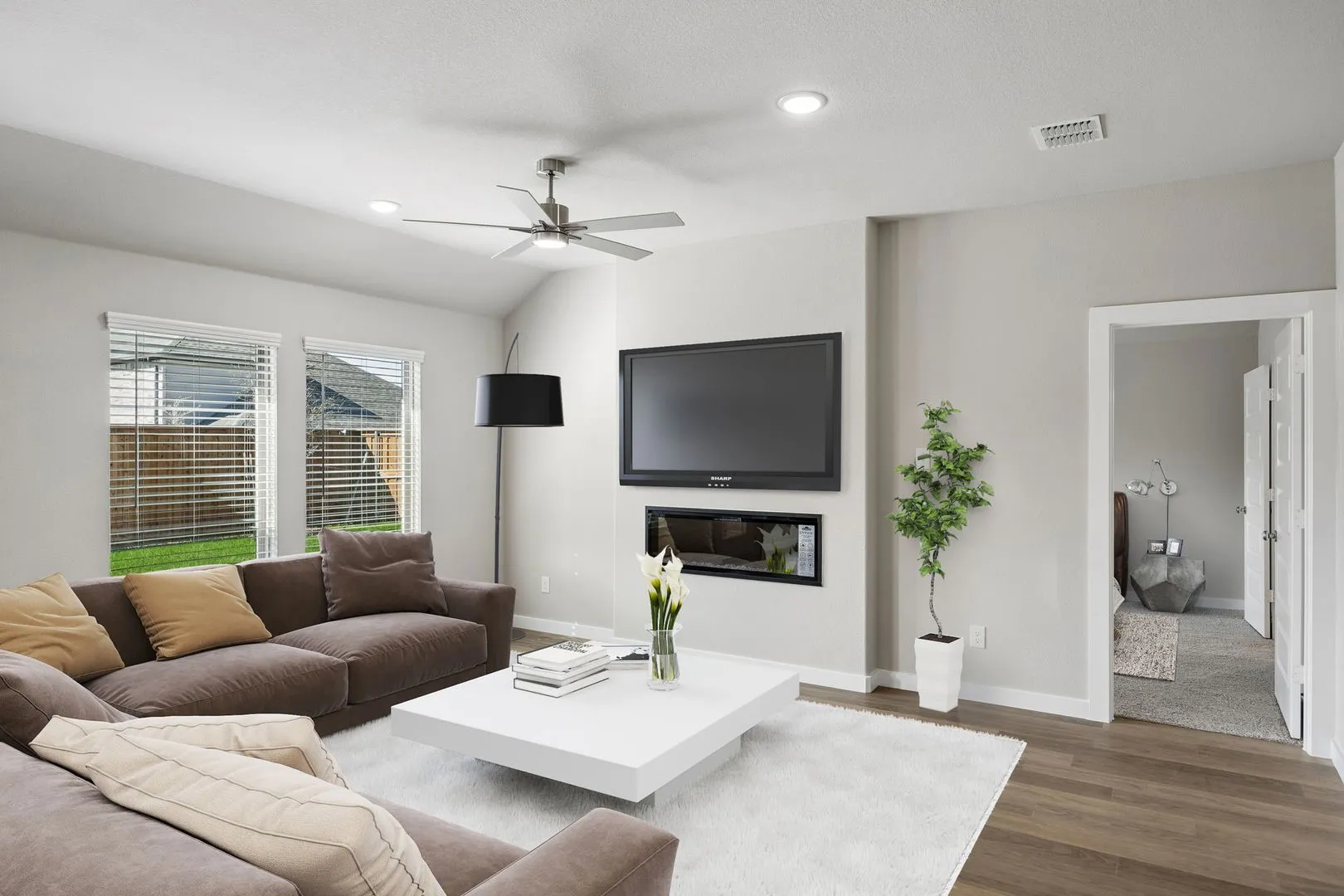Living Room in the Emmy II home plan by Trophy Signature Homes - REPRESENTATIVE PHOTO