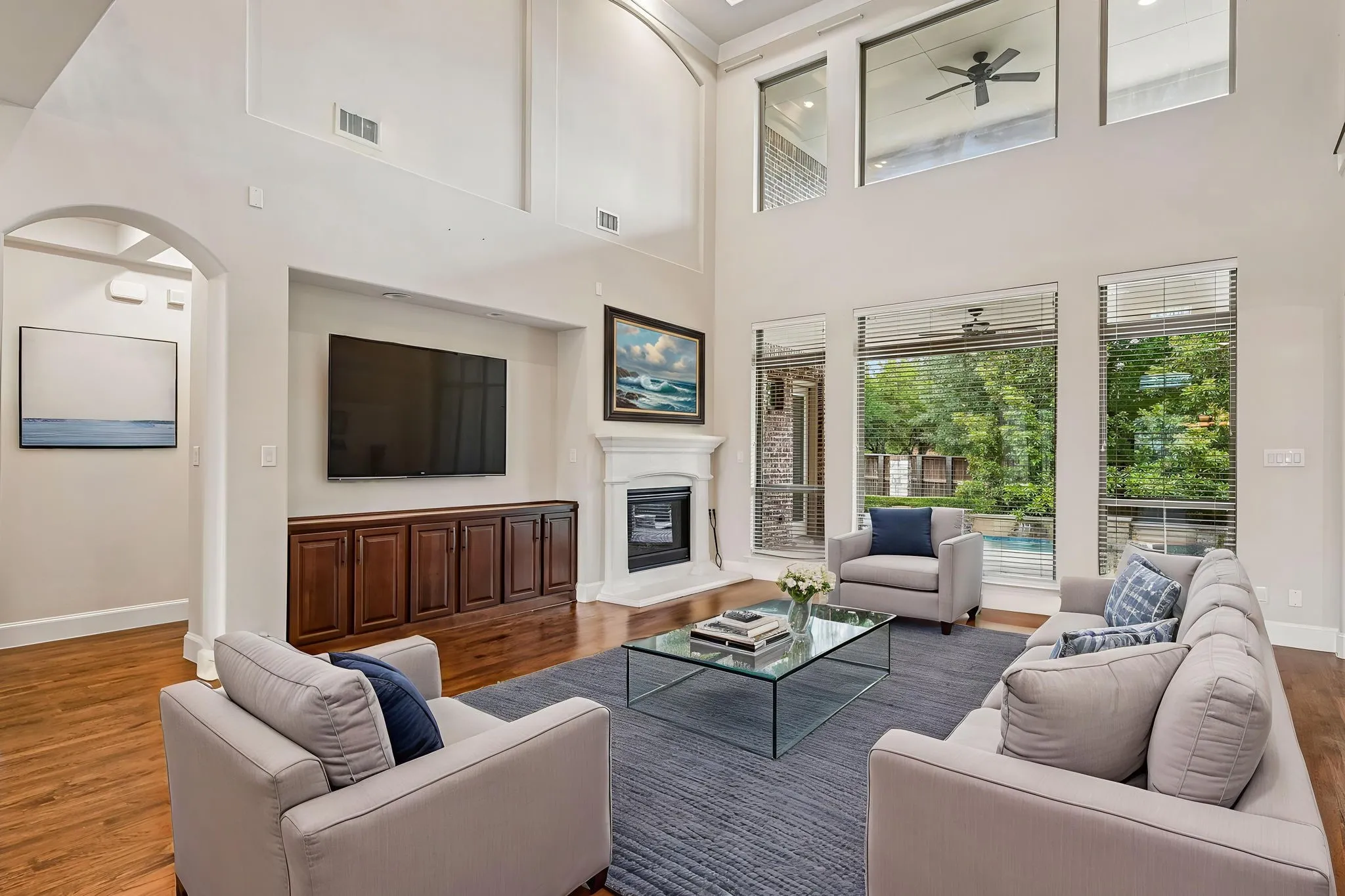 Open concept living room w tons of natural light - digitally staged