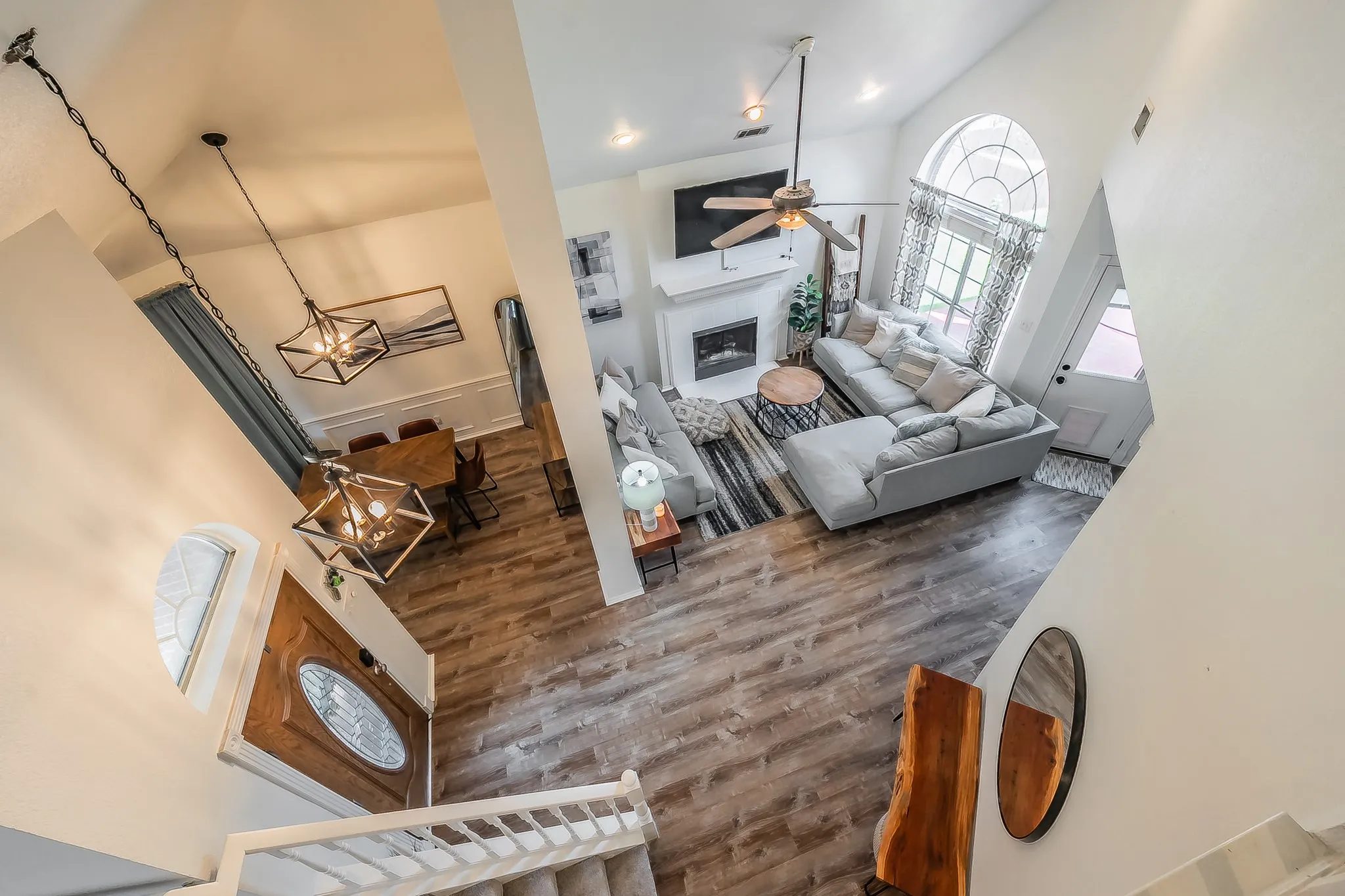 Open-concept interior featuring high ceilings and wood-finish flooring