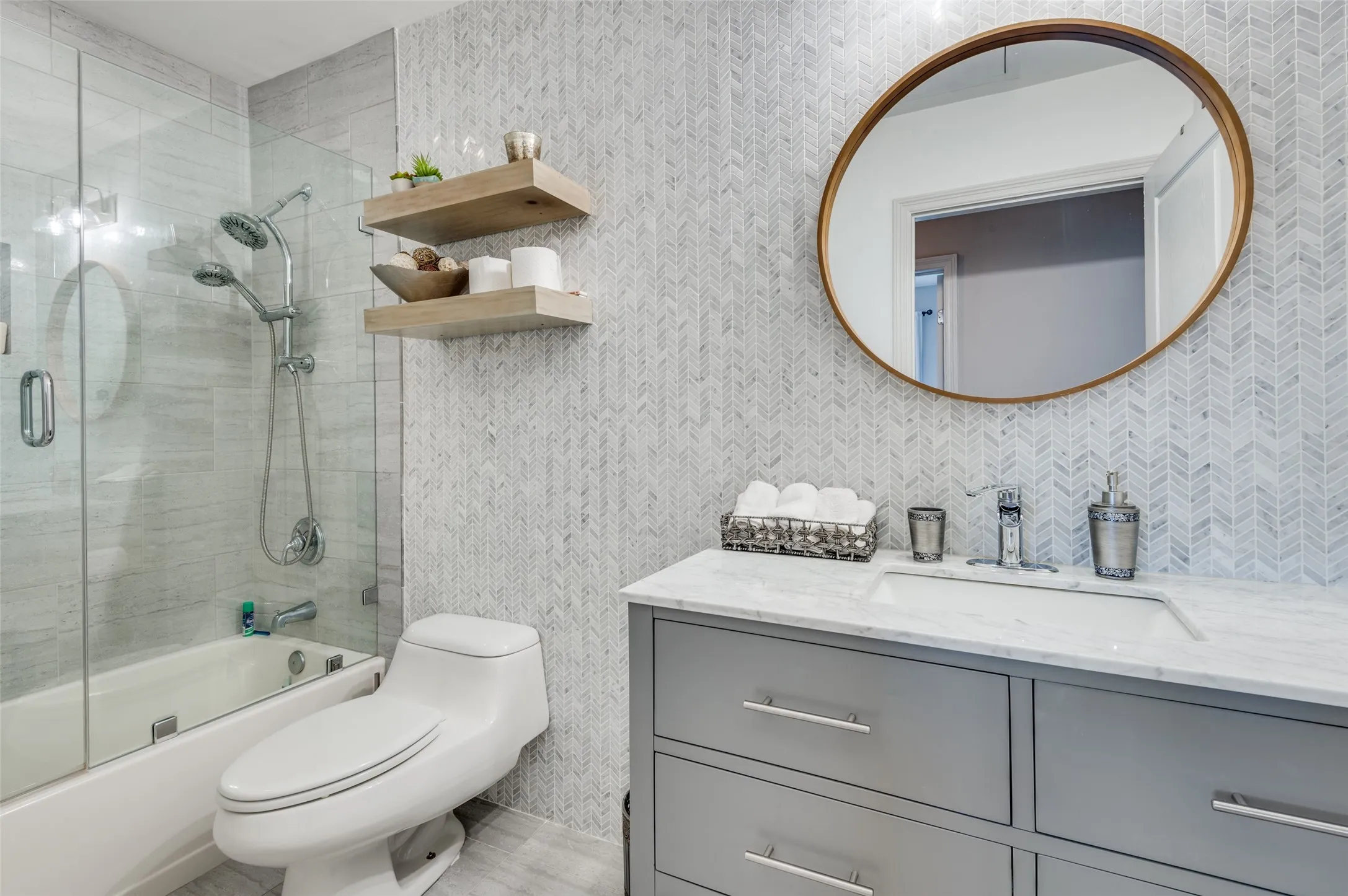 Updated hall bathroom is easily accessible from 2ndary bedroom and living area
