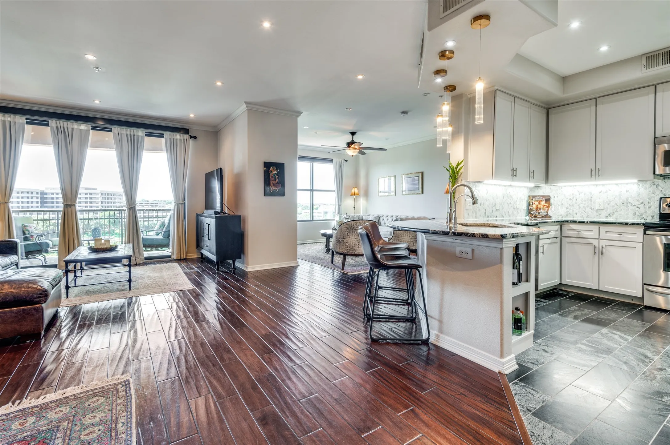 Another view of the kitchen and living room shows openness that promotes easy entertaining