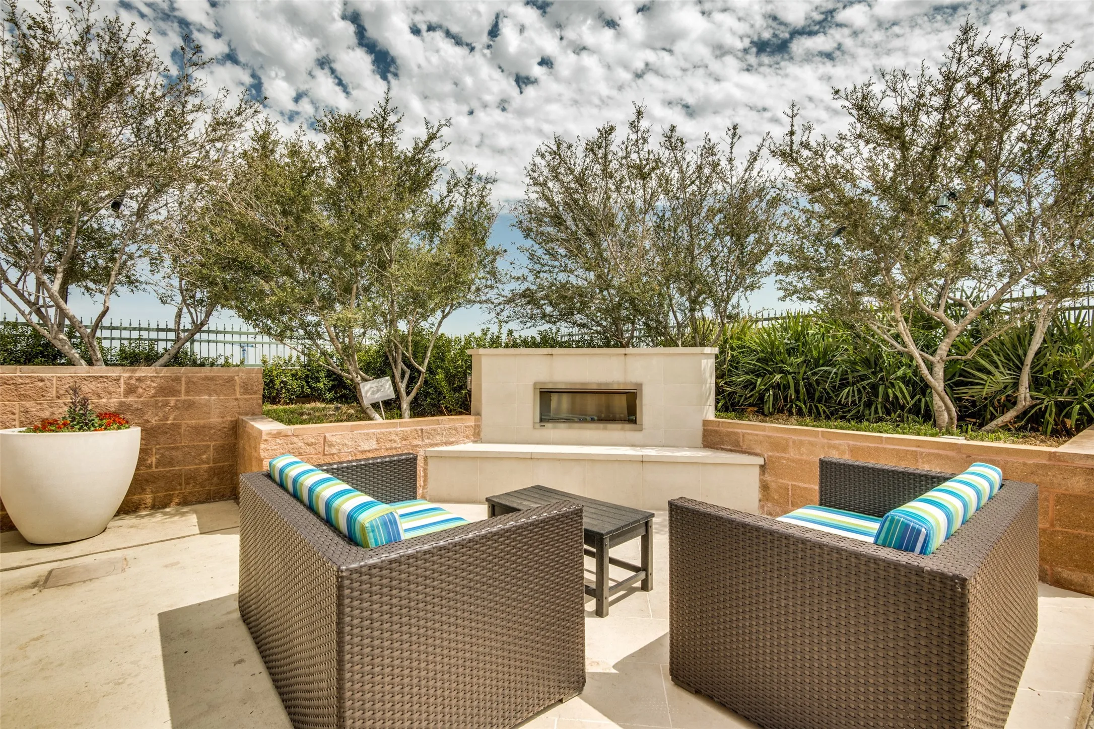 Gas fireplace with seating is perfect for enjoying time with friends and neighbors