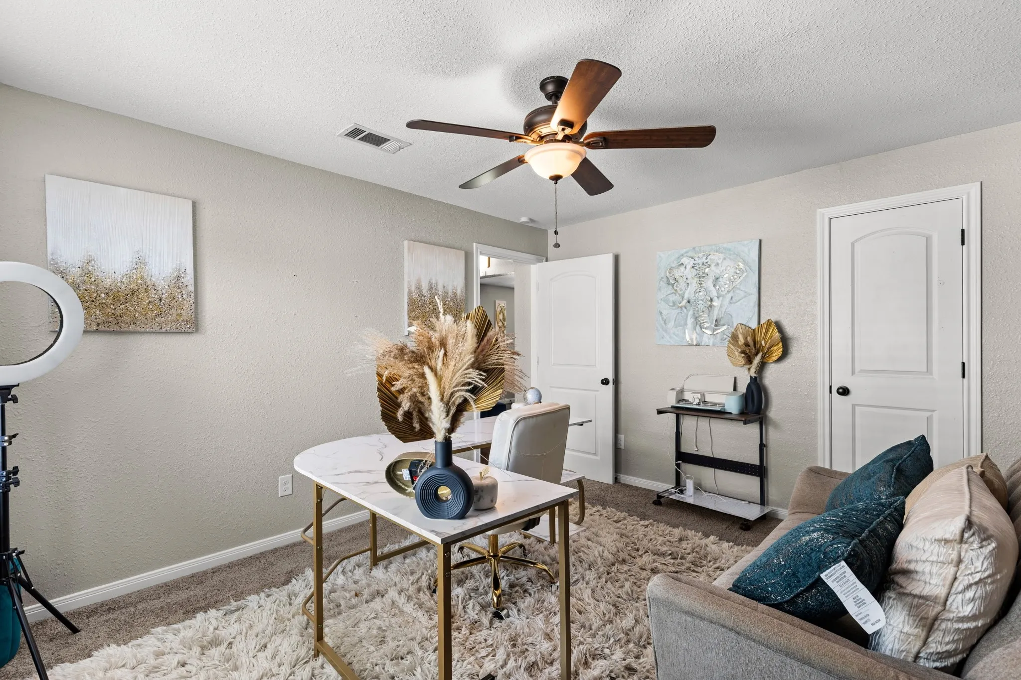 Room featuring neutral wall paint, a ceiling fan with integrated lighting, and carpet flooring