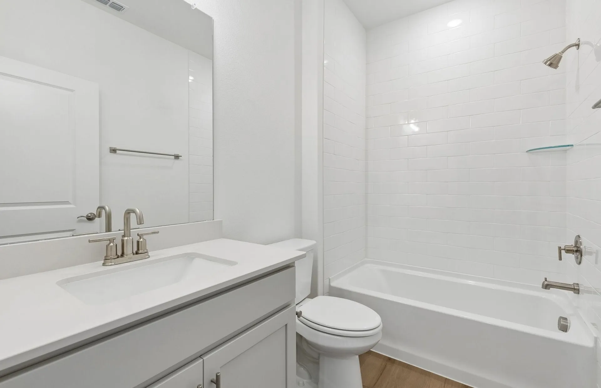Secondary bath with tile surrounded shower