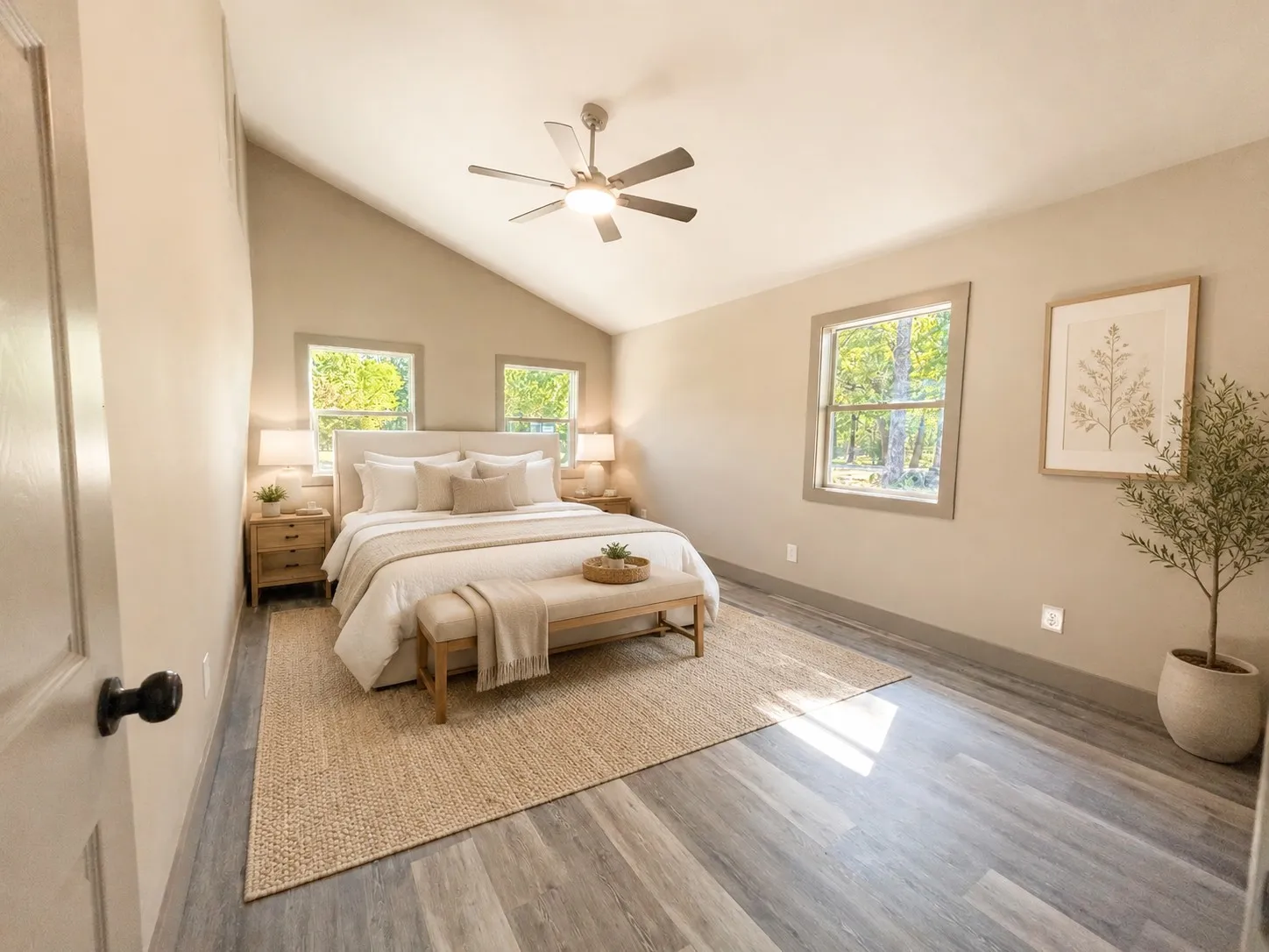 Vaulted ceiling, ceiling fan, two windows, wood-finish flooring, and recessed lighting