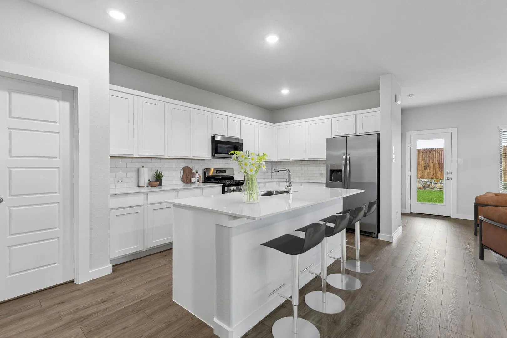 Kitchen in the Oscar home plan by Trophy Signature Homes – REPRESENTATIVE PHOTO