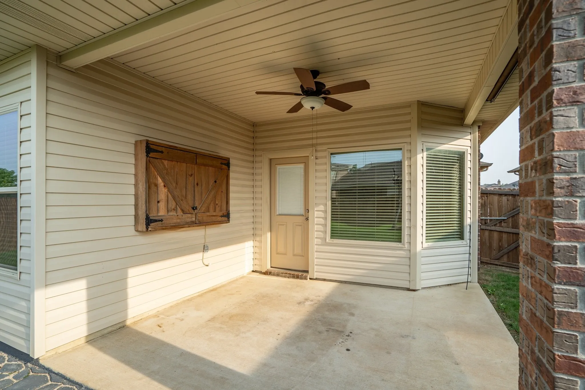 View of patio featuring ceiling fan