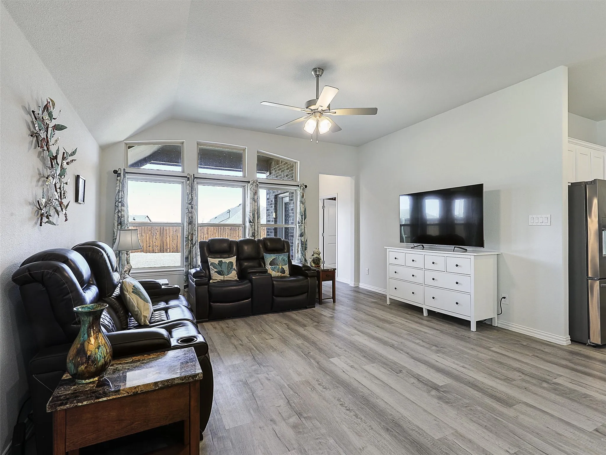 Large living area that overlooks the covered patio and backyard