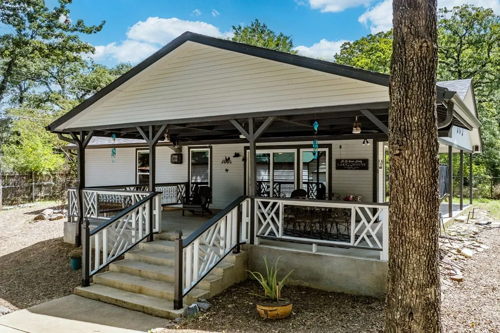 Expansive lake view covered side porch