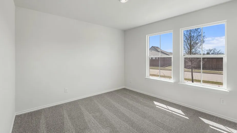 Room featuring two large windows, neutral gray carpet, white walls, white baseboards, and a recessed ceiling light