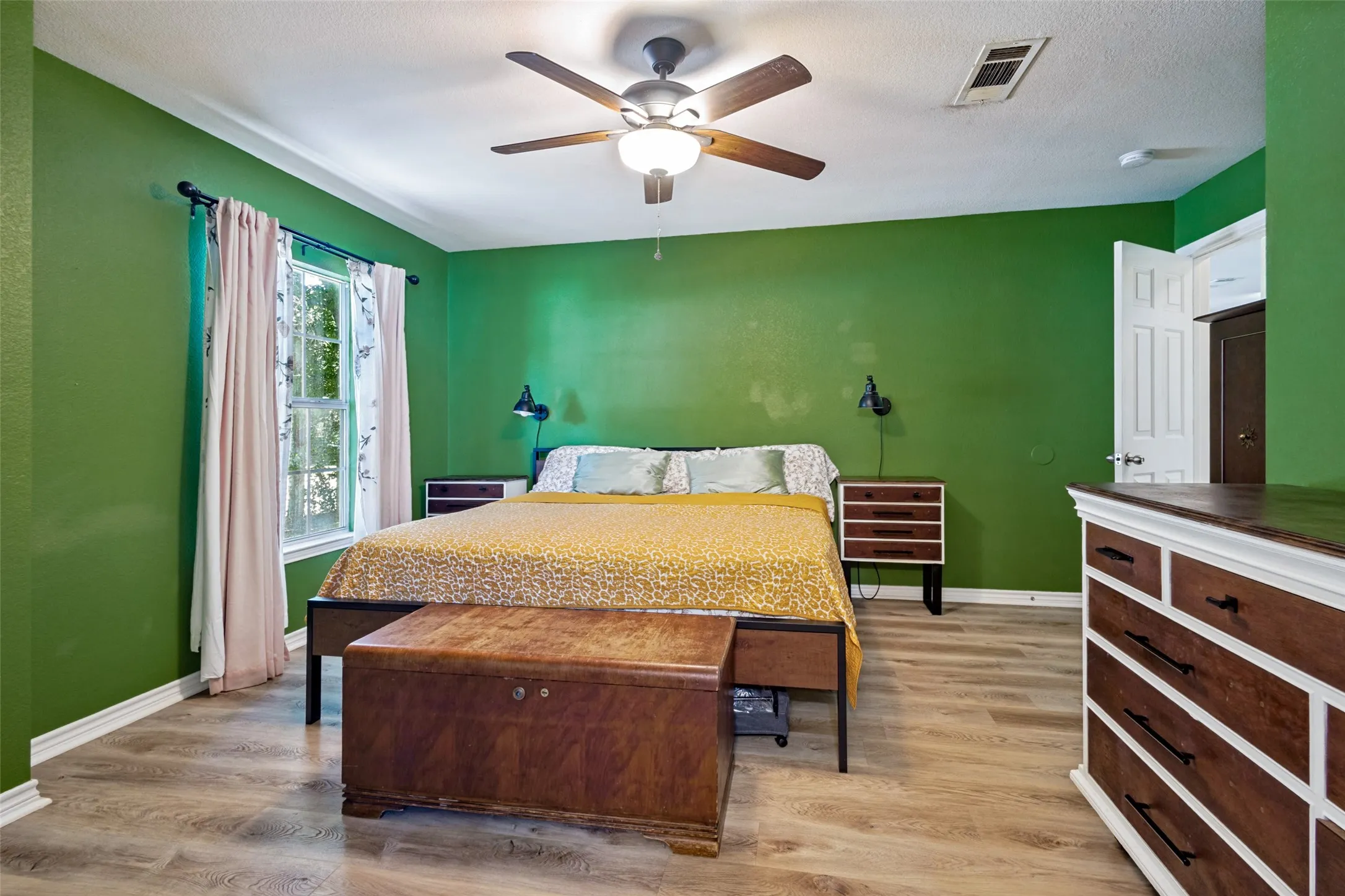 The primary bedroom is light, bright and roomy!