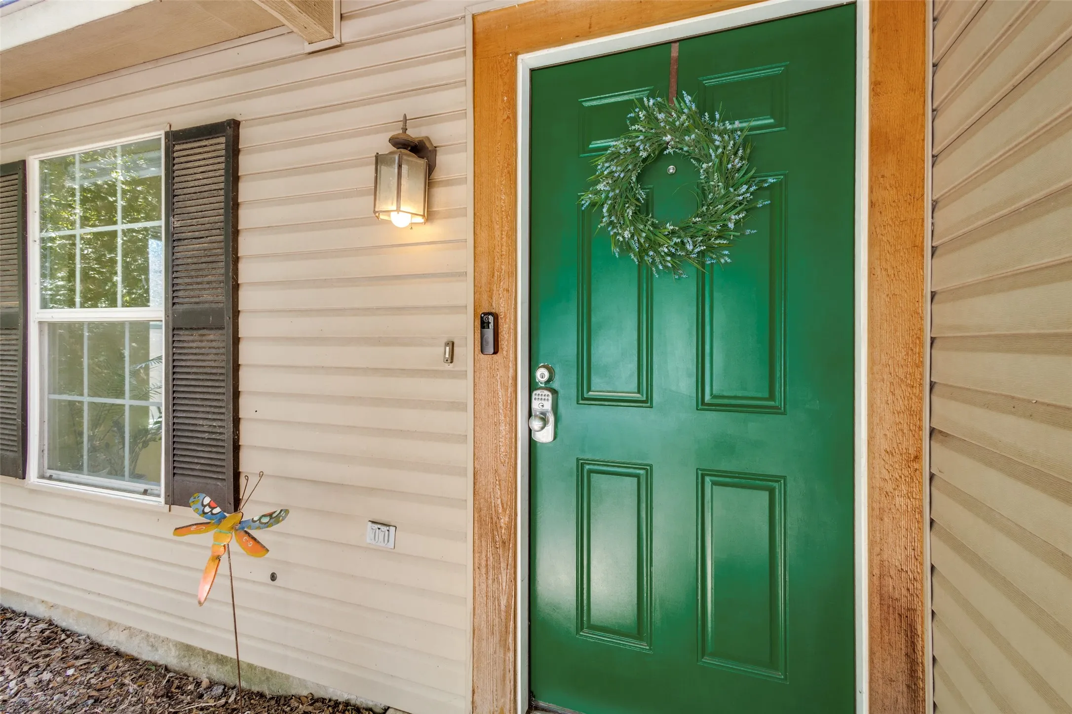Inviting front door with electronic keyless lock.