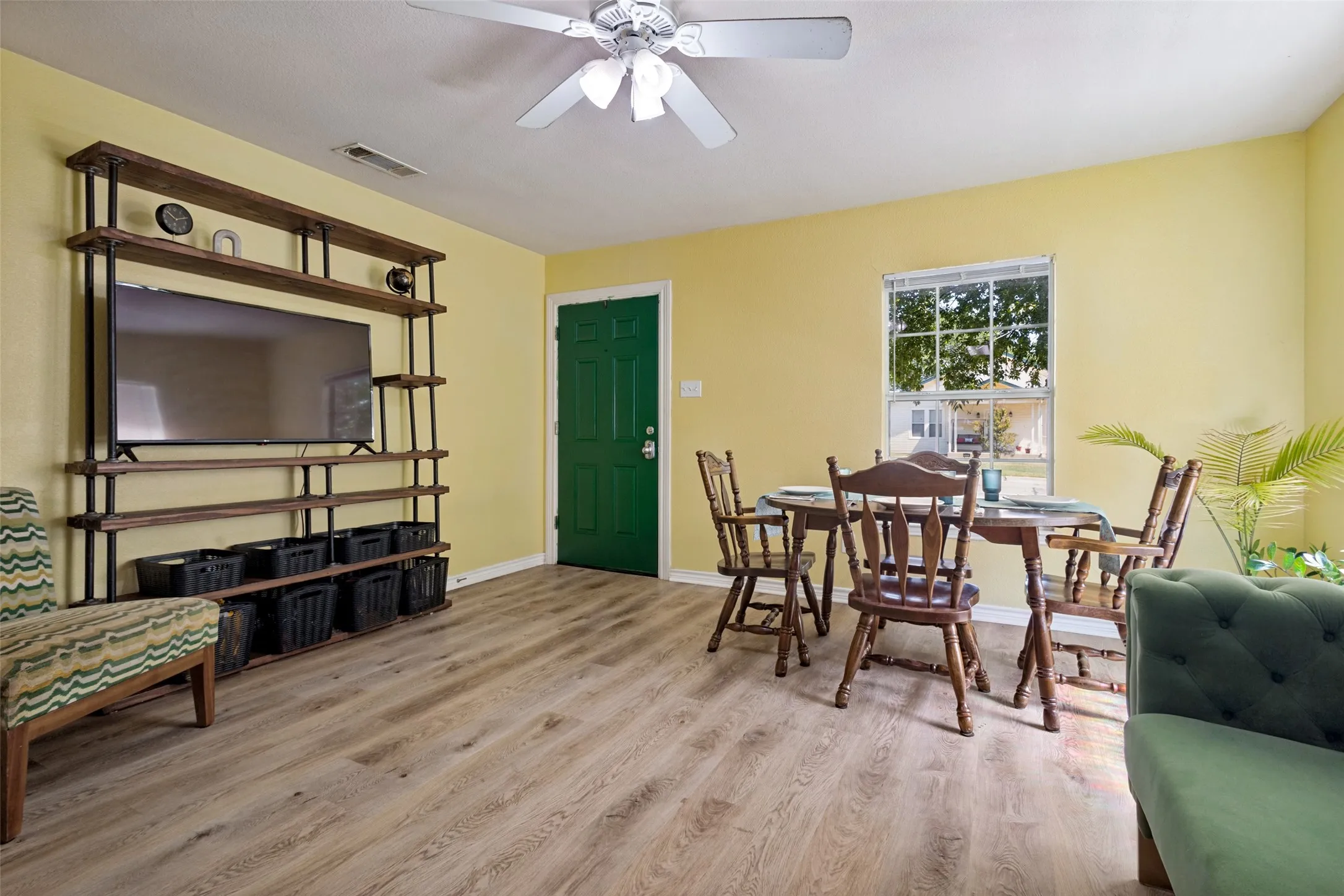 The living room features the new luxury vinyl flooring that can be found throughout the home.
