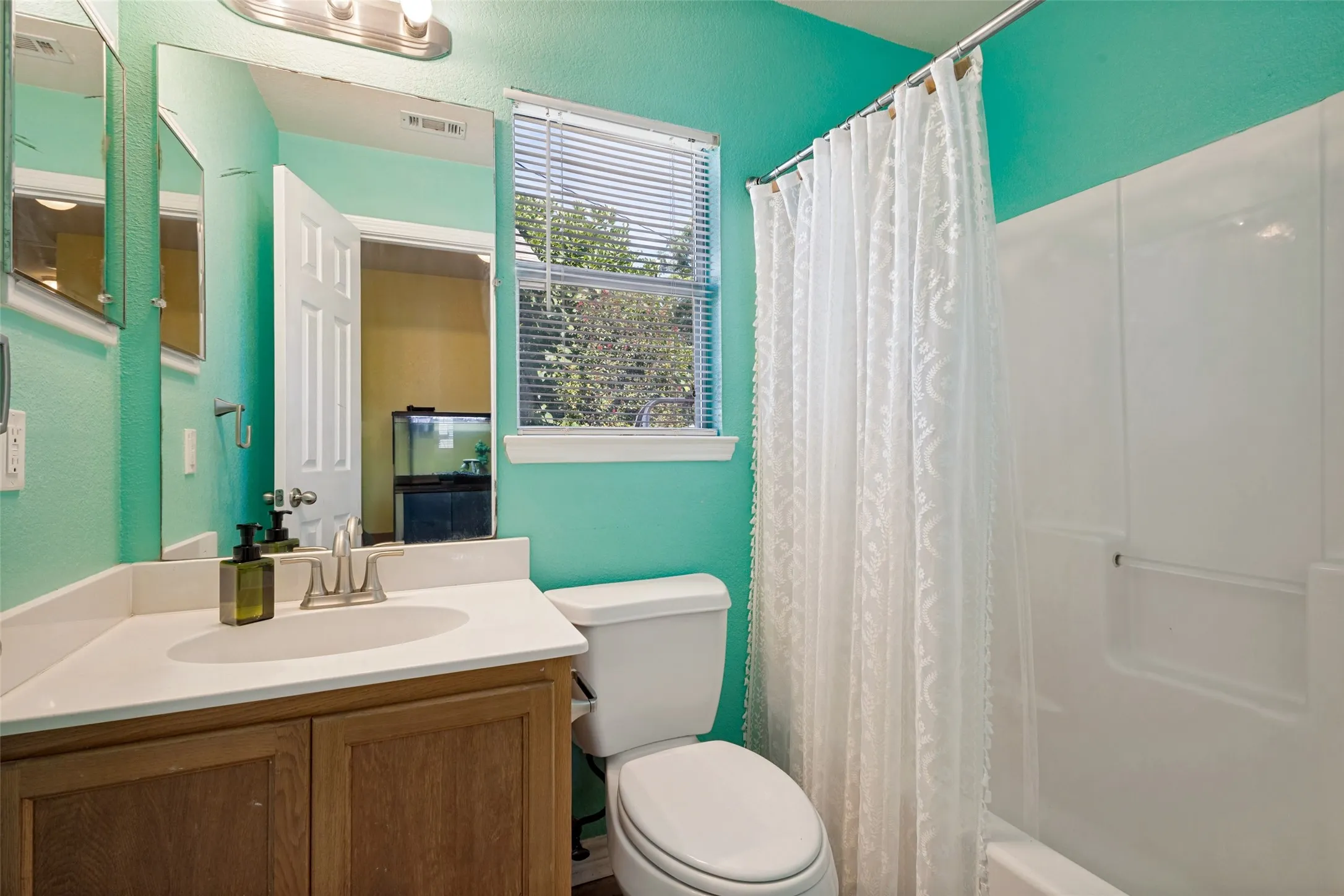 The second bath has a built-in mirrored medicine cabinet and is easily accessible at the end of the hallway.