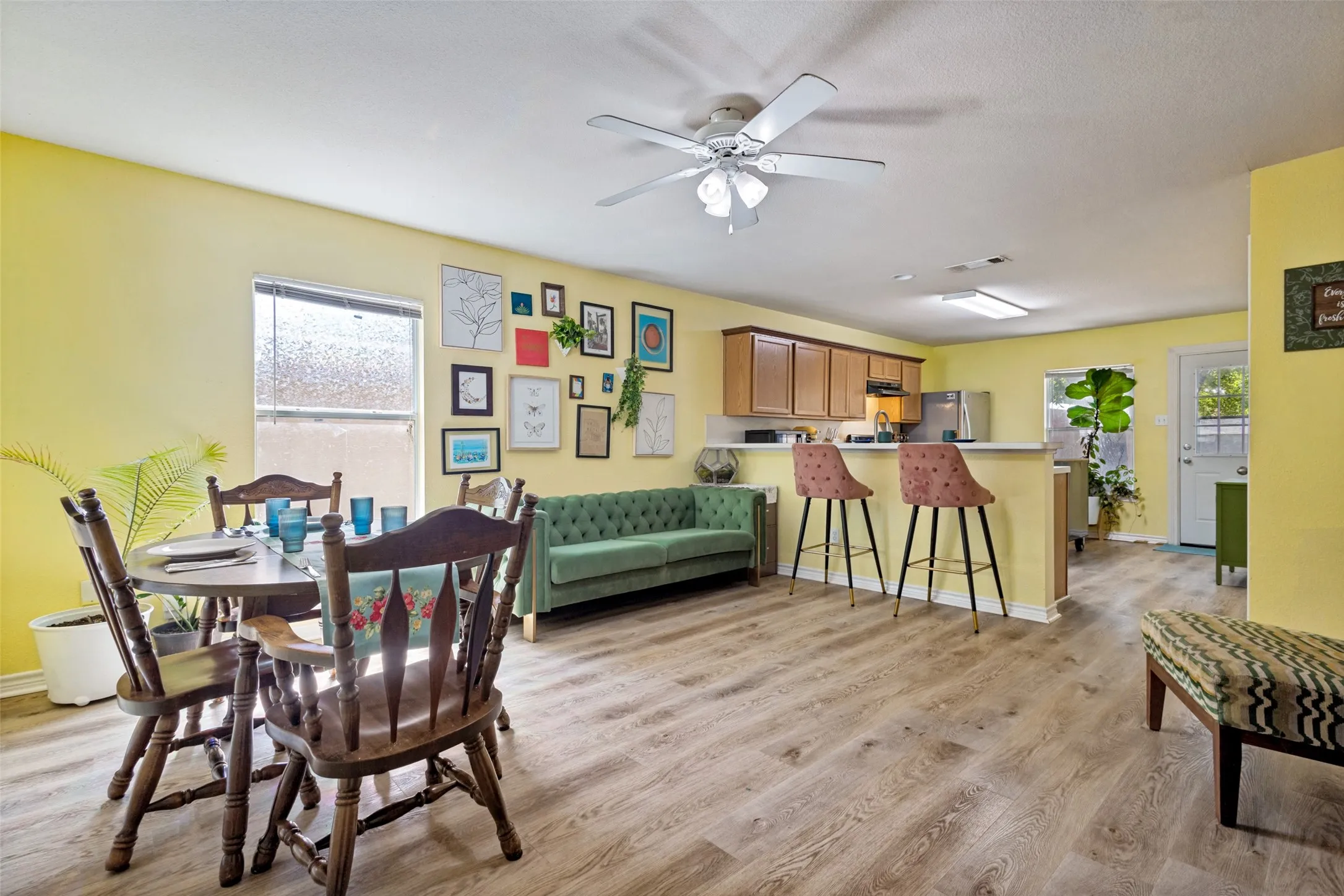 The view from the front door shows the open floor plan of the living and dining areas.