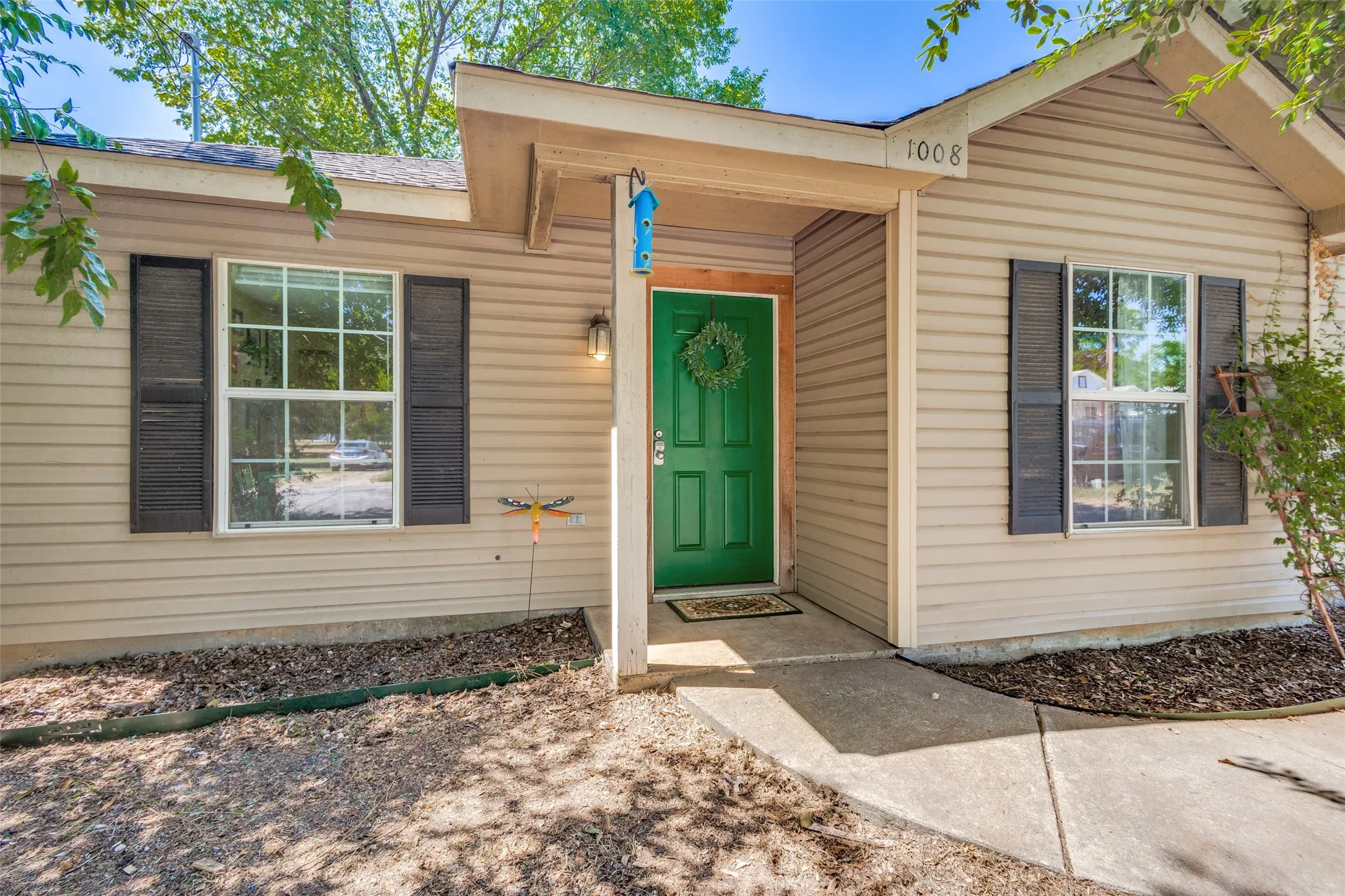 Painted shutters and covered front porch add to the exterior charm of this home.
