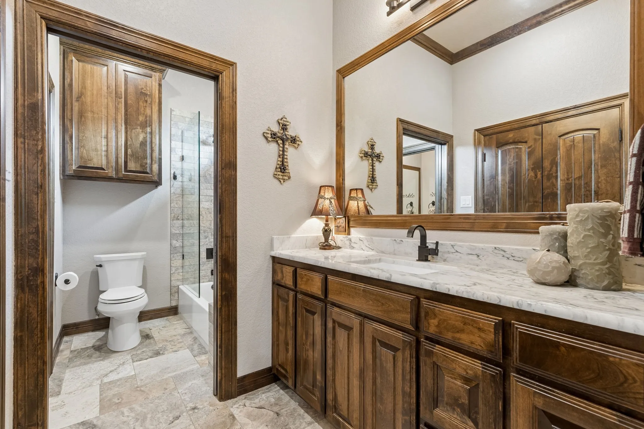 Private vanity and closet in one of the two bedrooms that share a jack and Jill bathroom.