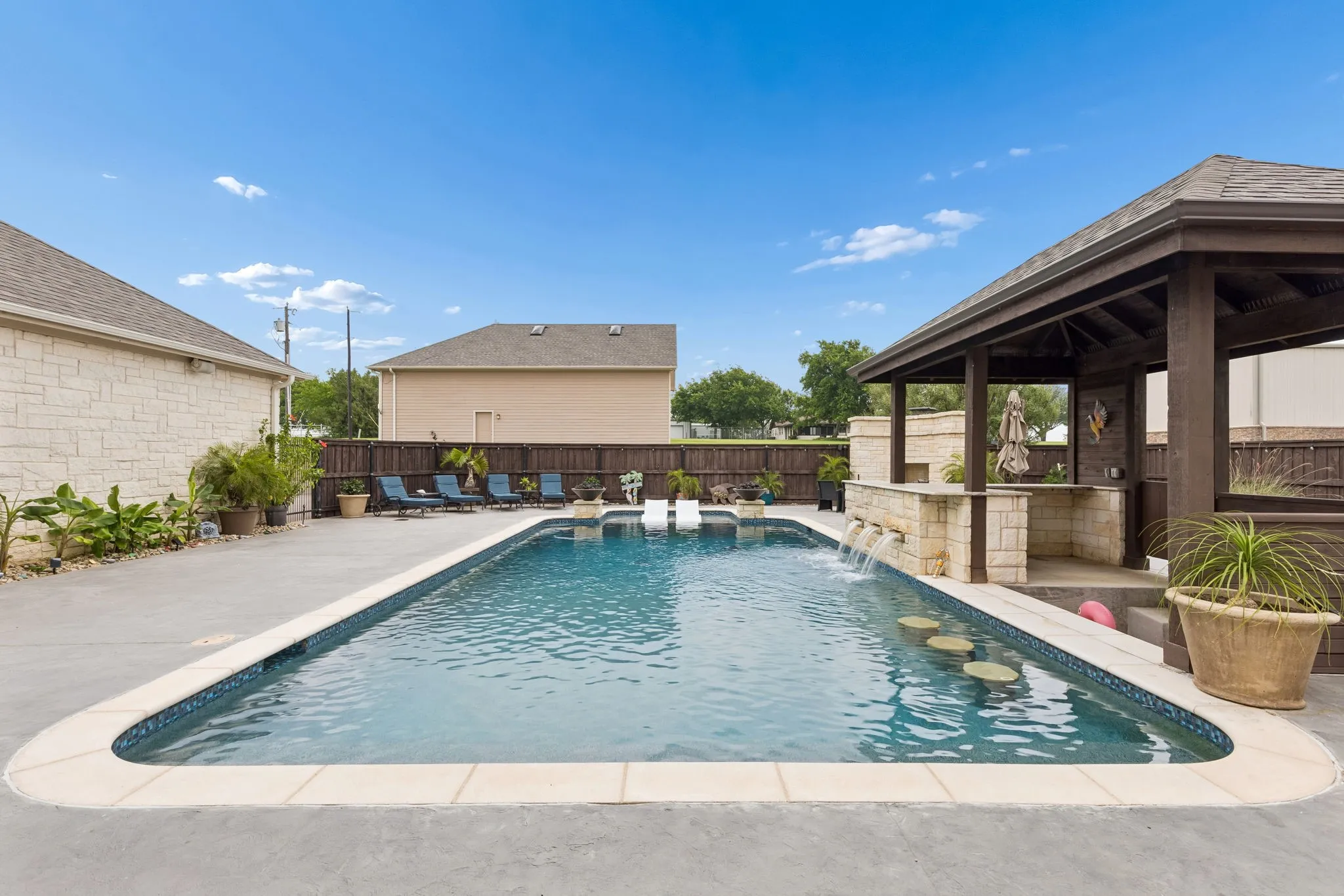 Swim up bar, waterfalls, tanning ledge and room for plenty of friends and guests to create memories.