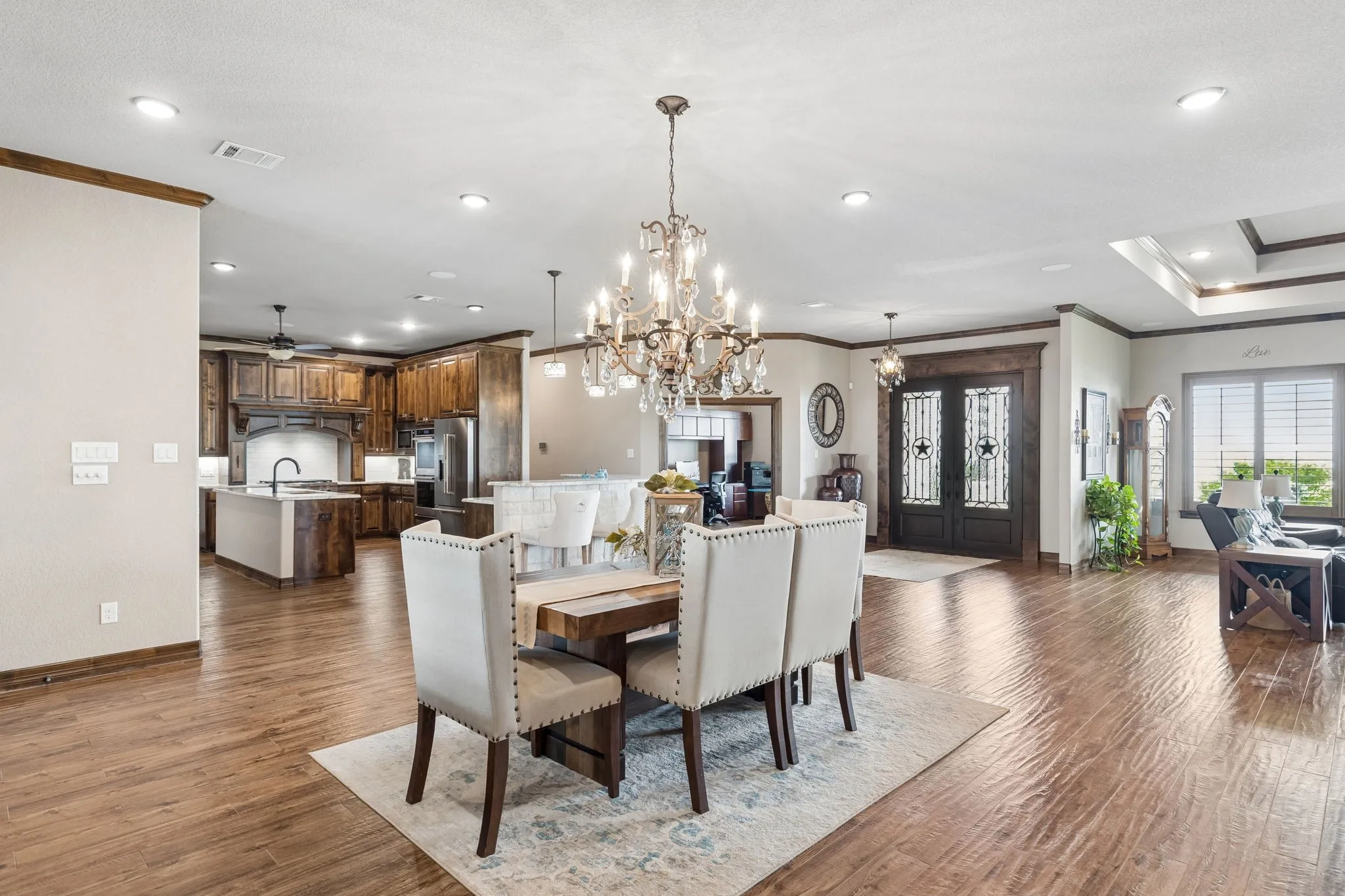 The exquisite chandelier anchors this space.