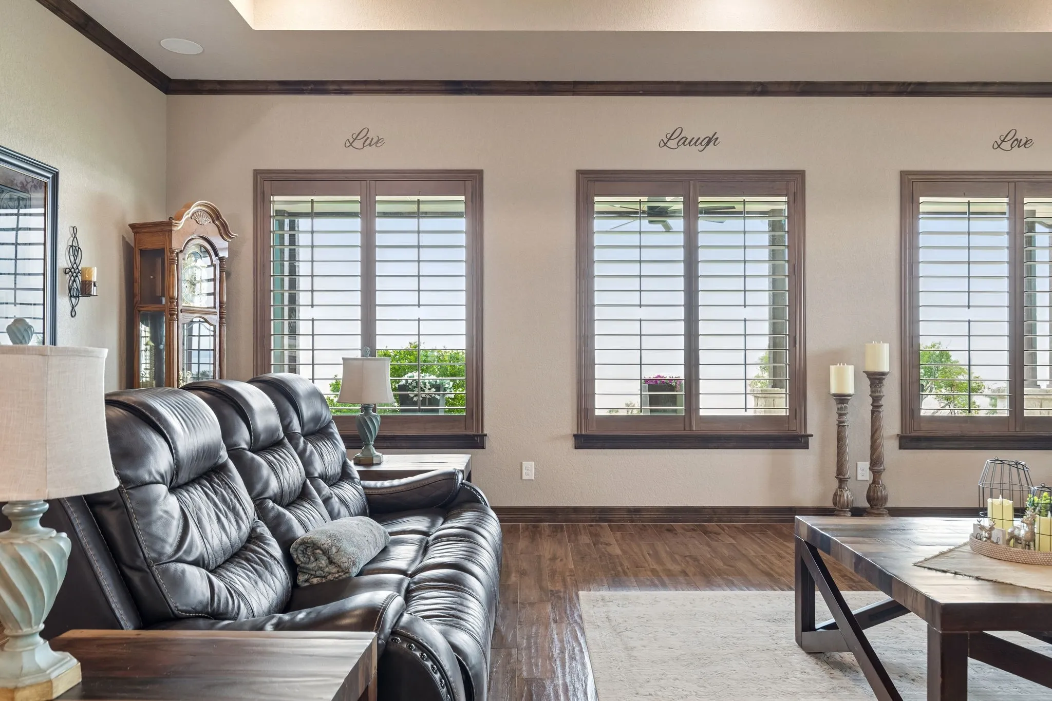 Tray ceiling, stained crown molding and energy efficient windows highlight the architectural details of the living area.