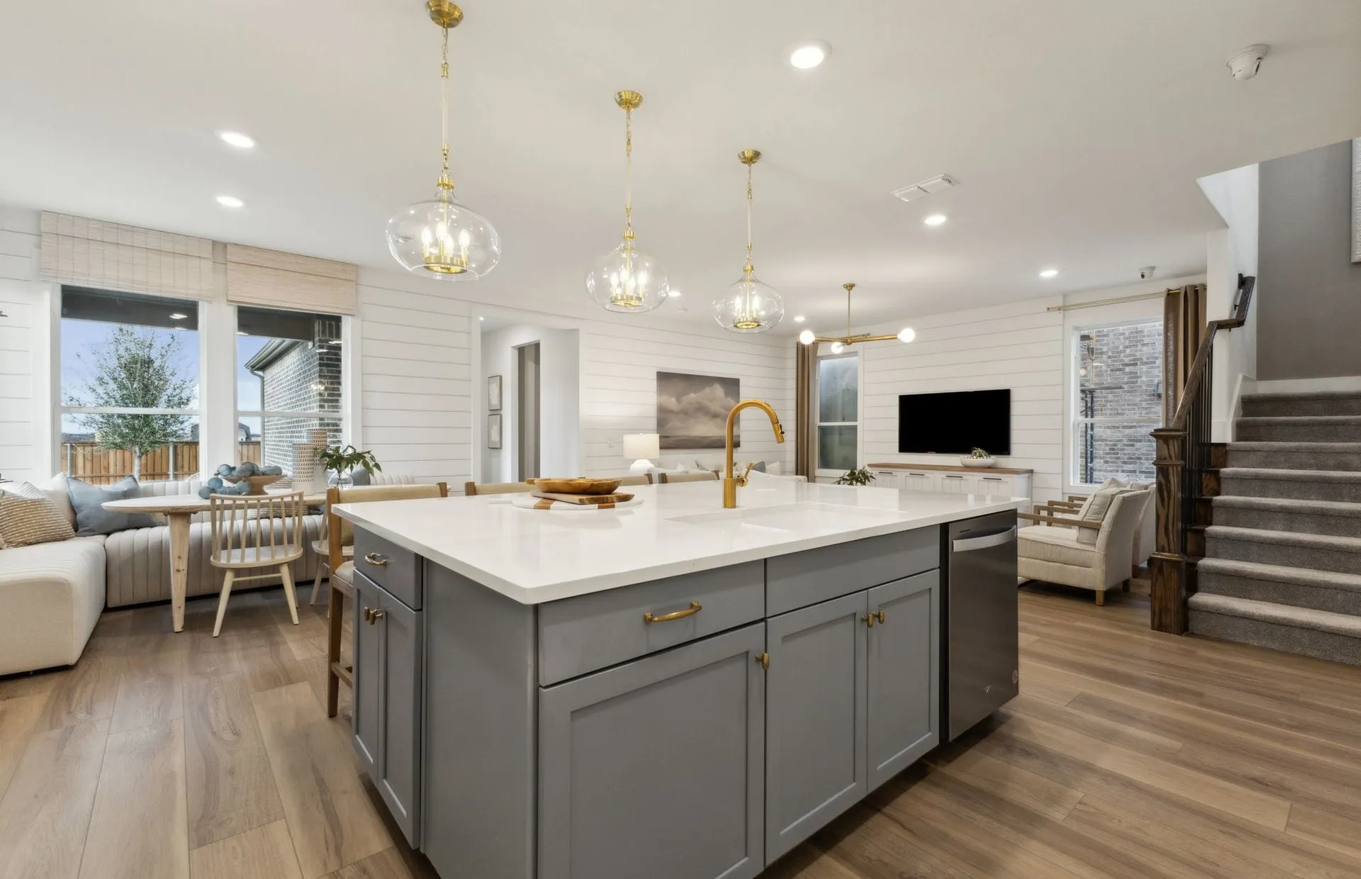 *Model Representation - Large island overlooking gathering room and dining areas