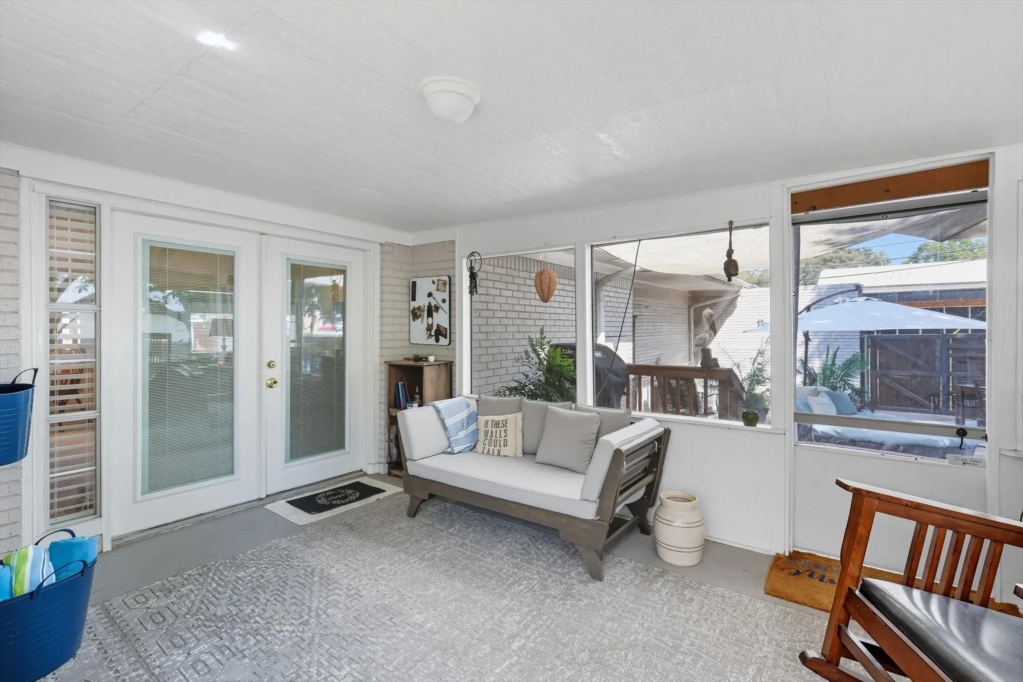 Sunroom featuring french doors