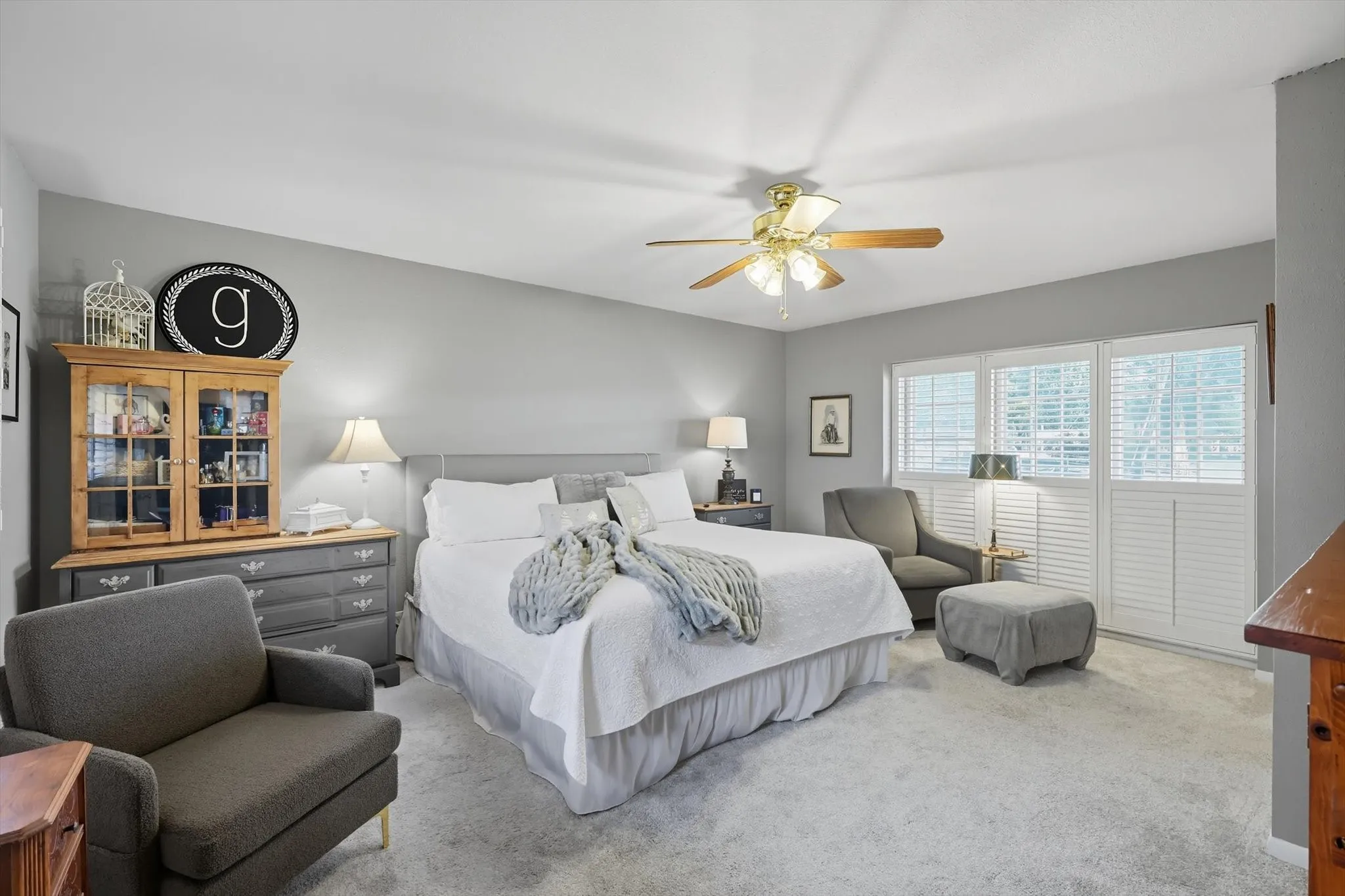 Bedroom featuring light colored carpet and ceiling fan