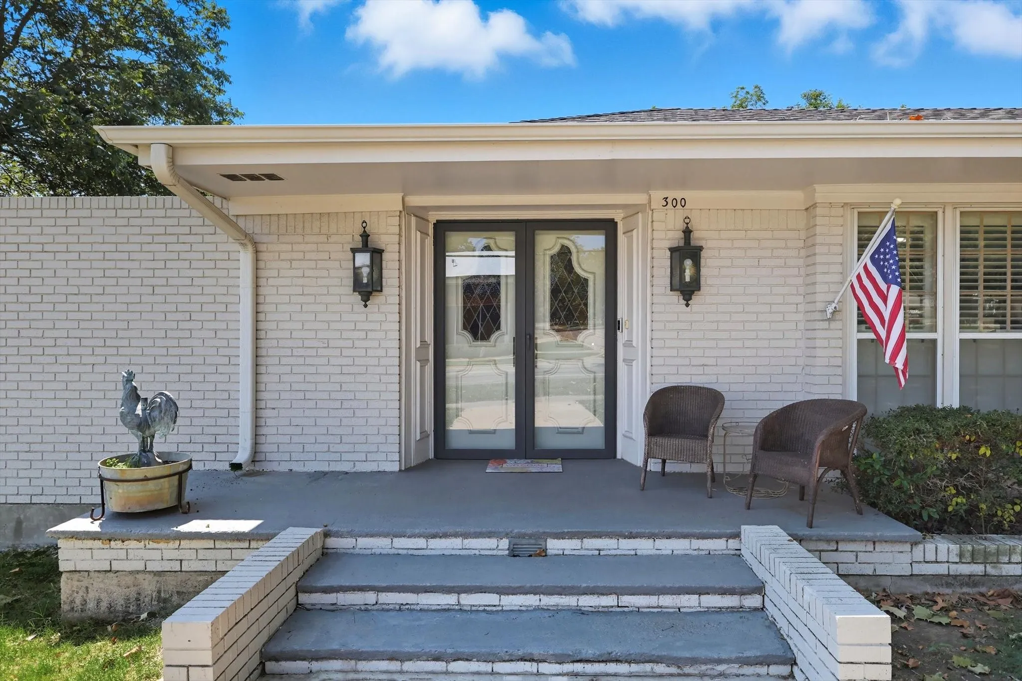 Entrance to property featuring brick siding