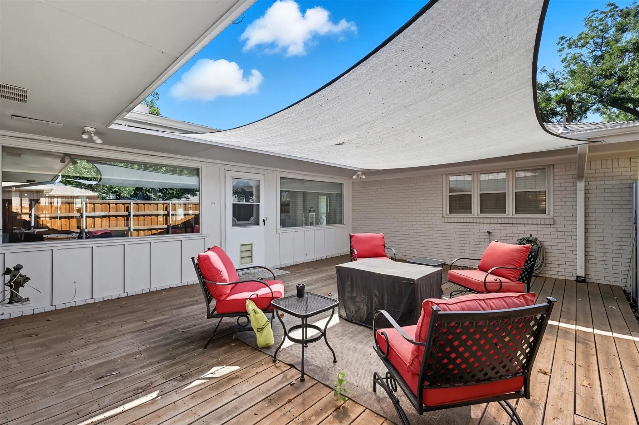 Wooden terrace with an outdoor hangout area