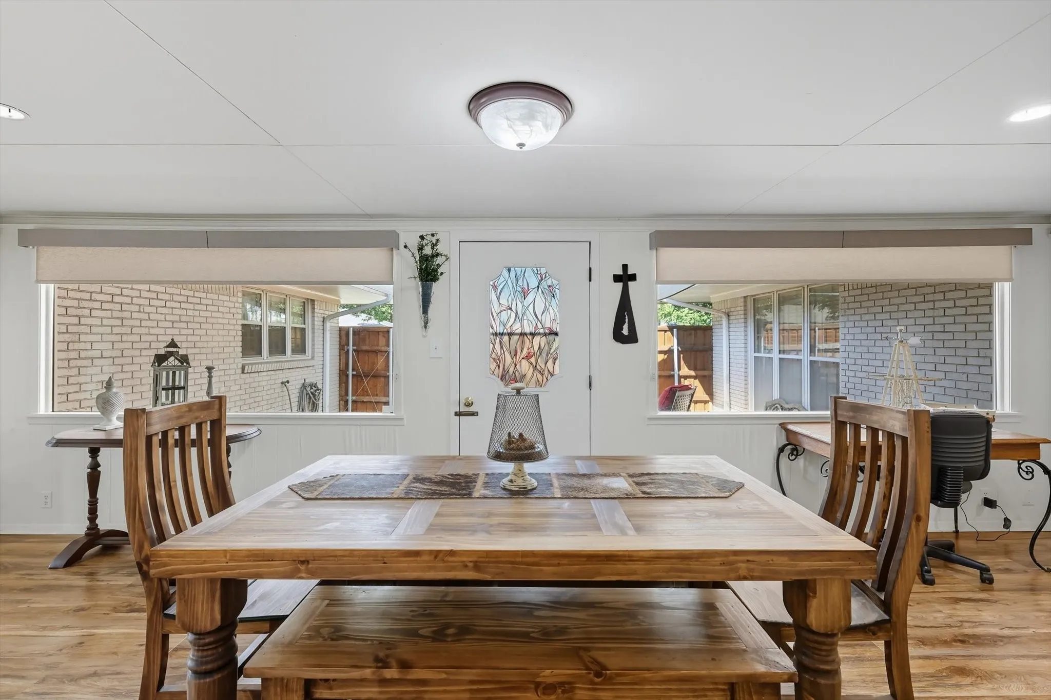 Dining room featuring light wood-style flooring and recessed lighting