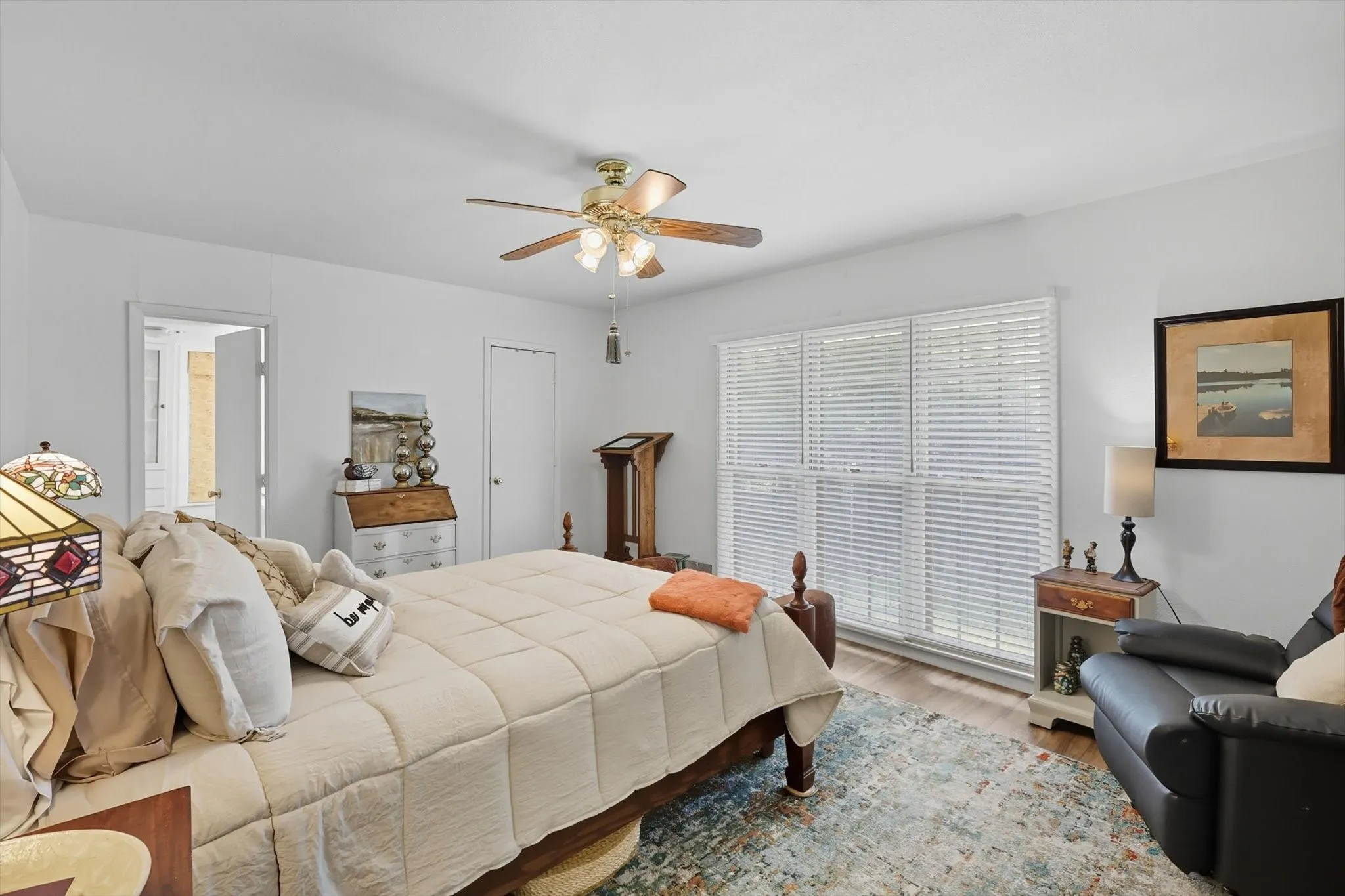 Bedroom featuring wood finished floors and ceiling fan