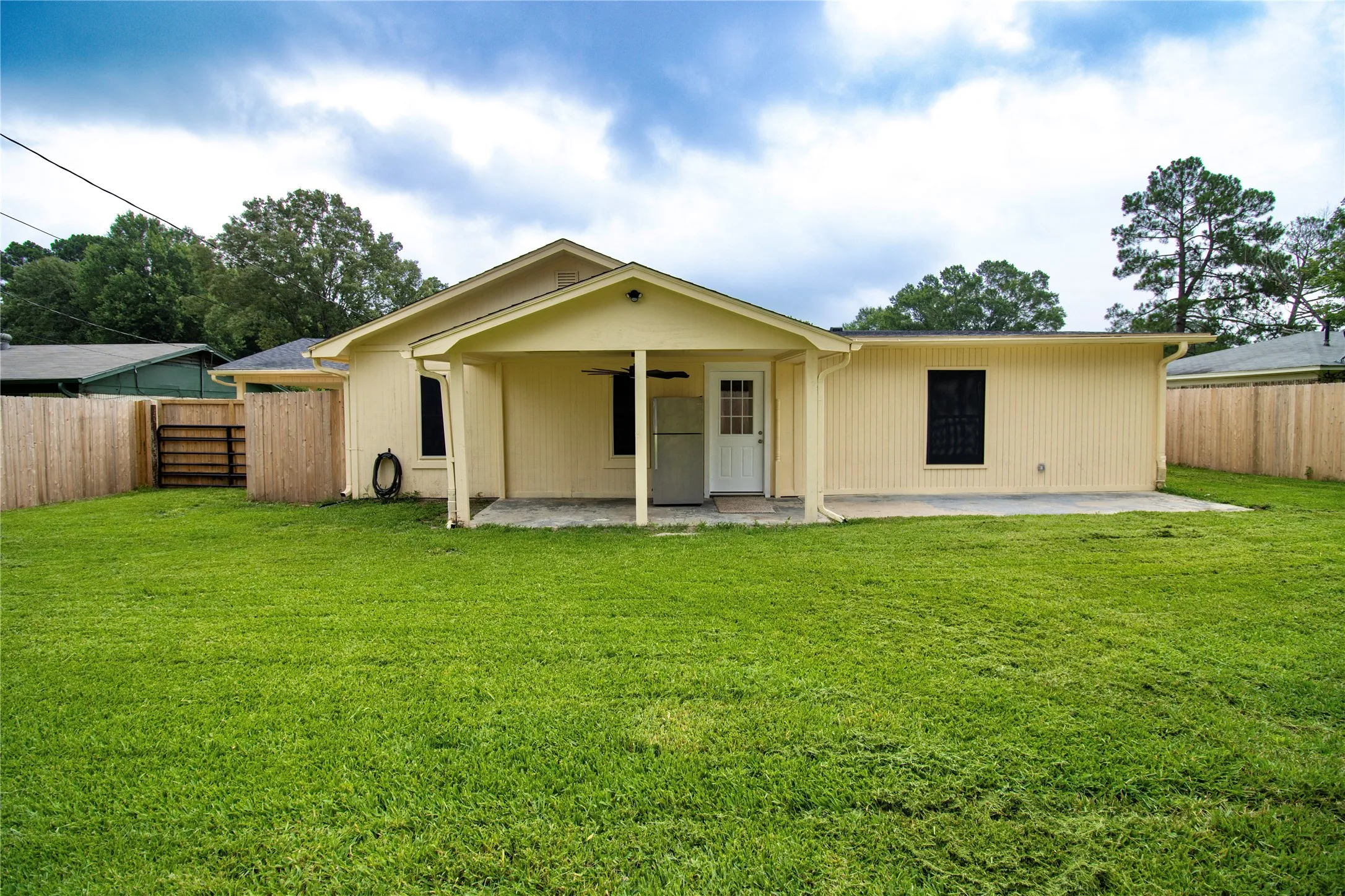 Expansive green lawn providing ample outdoor space