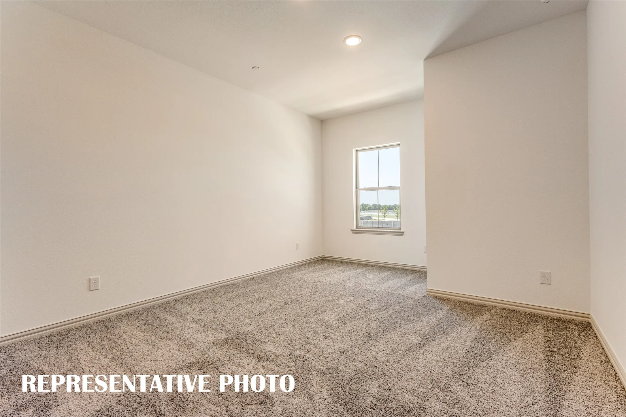 You'll find nicely sized secondary bedrooms in our Emily floor plan.  REPRESENTATIVE PHOTO