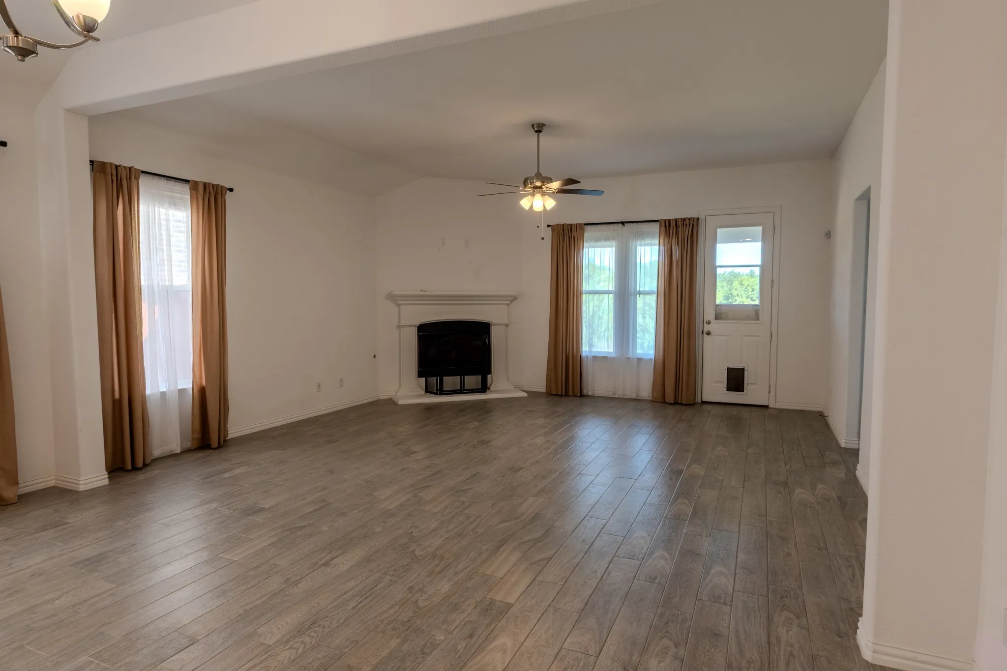 Wide-angle view highlights the generous size and flexibility of the main living area.