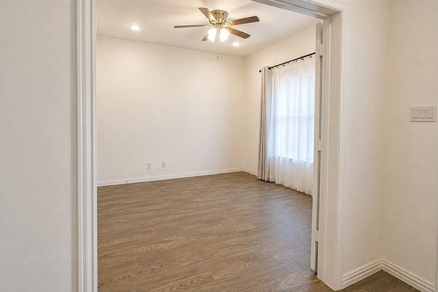 Additional flexible living space offers options for a dining room, second office, playroom, or sitting area.