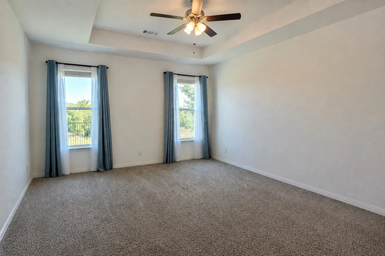 Bright additional room offers flexible use as a bedroom, game room, office, or additional living space.