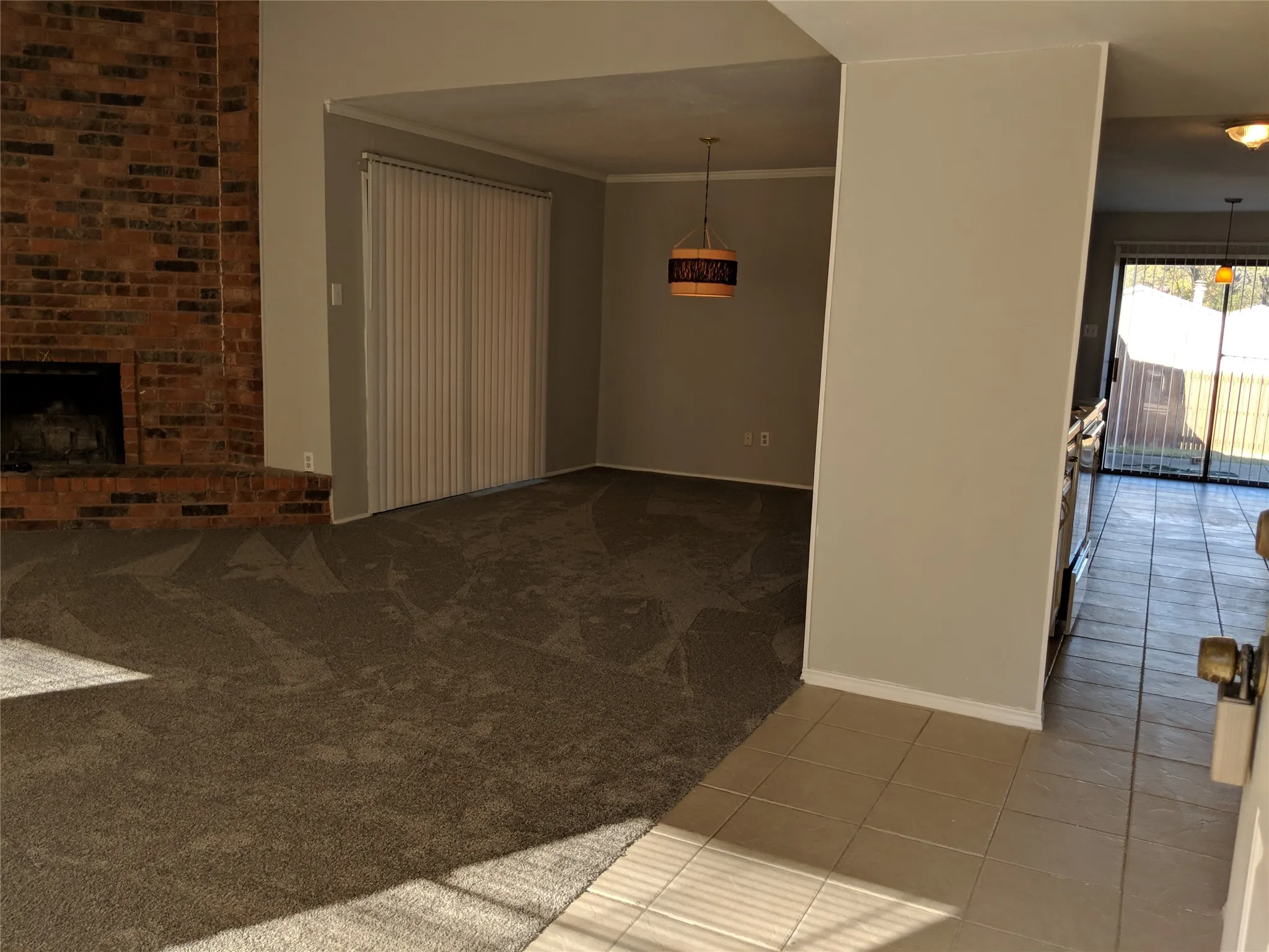 View from entry of Living Fireplace, dining, entry hallway to Kitchen