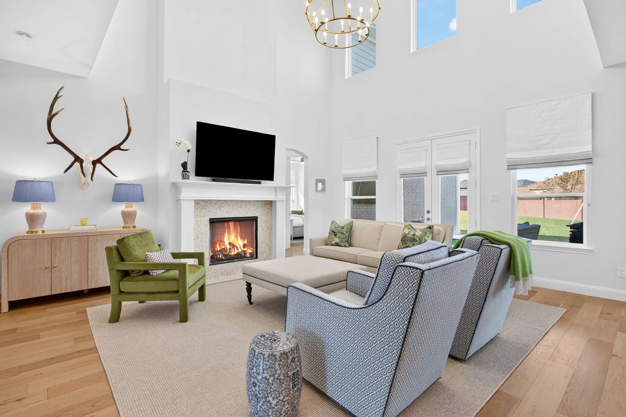 Soaring ceilings with double stack windows and gas FP.