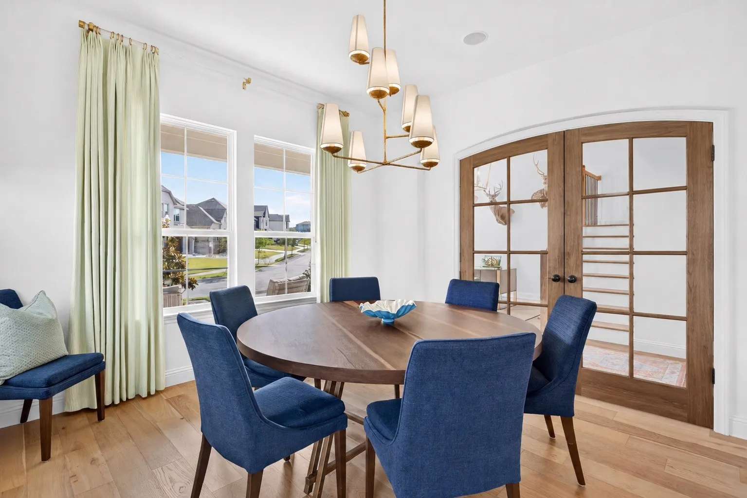 AI ALTERED IMAGE to show possibility to add French doors and use this space as a home office.