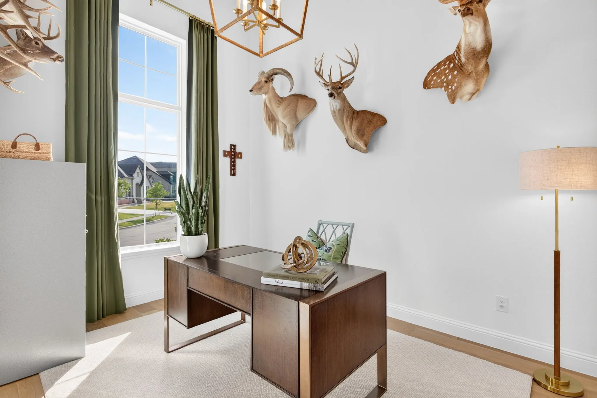 Office space with hardwood floors, soaring ceilings and custom drapes.