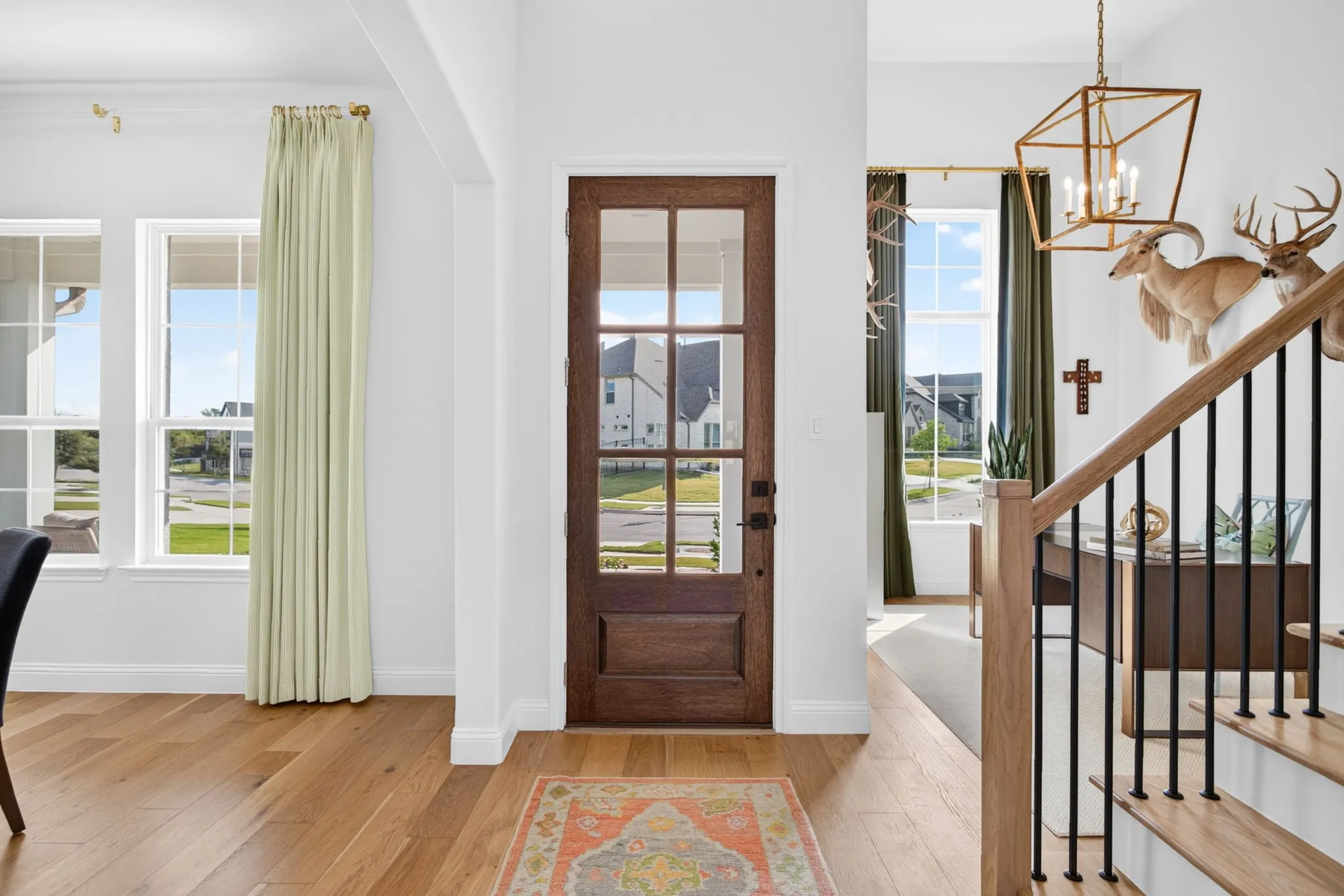 Foyer with 6 light front door, formal dining and office.